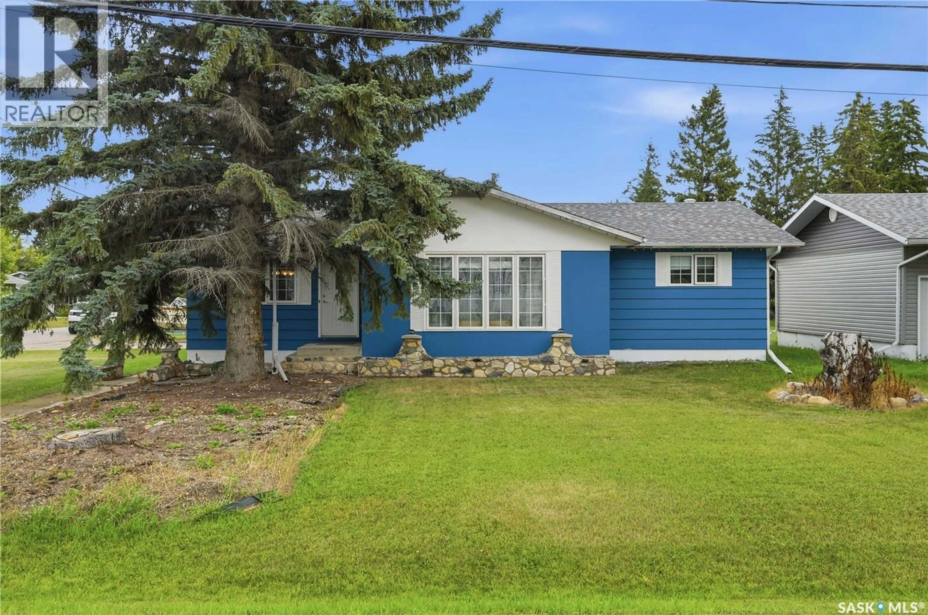 Home with vinyl exterior material, street for 310 2ND STREET, Hepburn Saskatchewan S0K1Z0