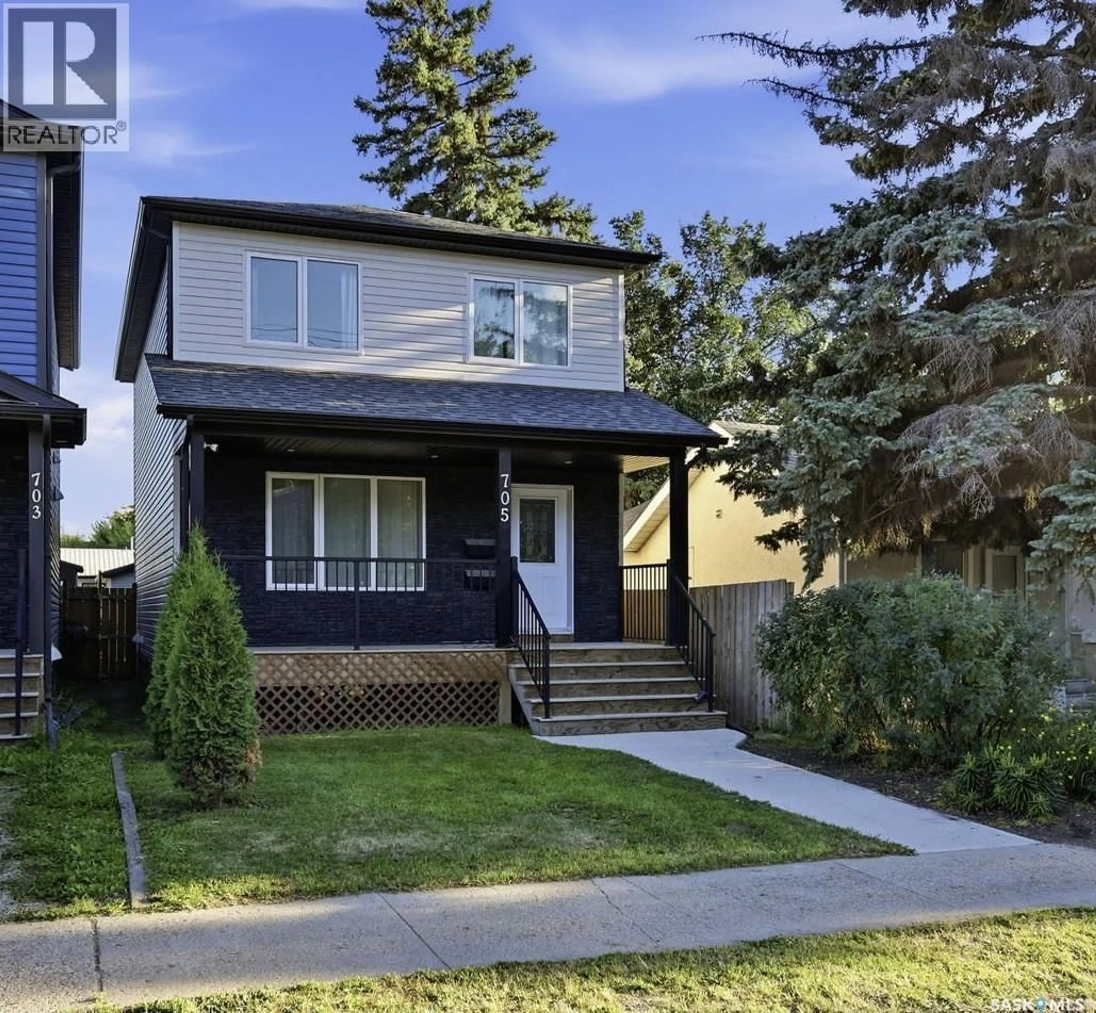 Home with vinyl exterior material, street for 705 33RD STREET, Saskatoon Saskatchewan S7L0W2