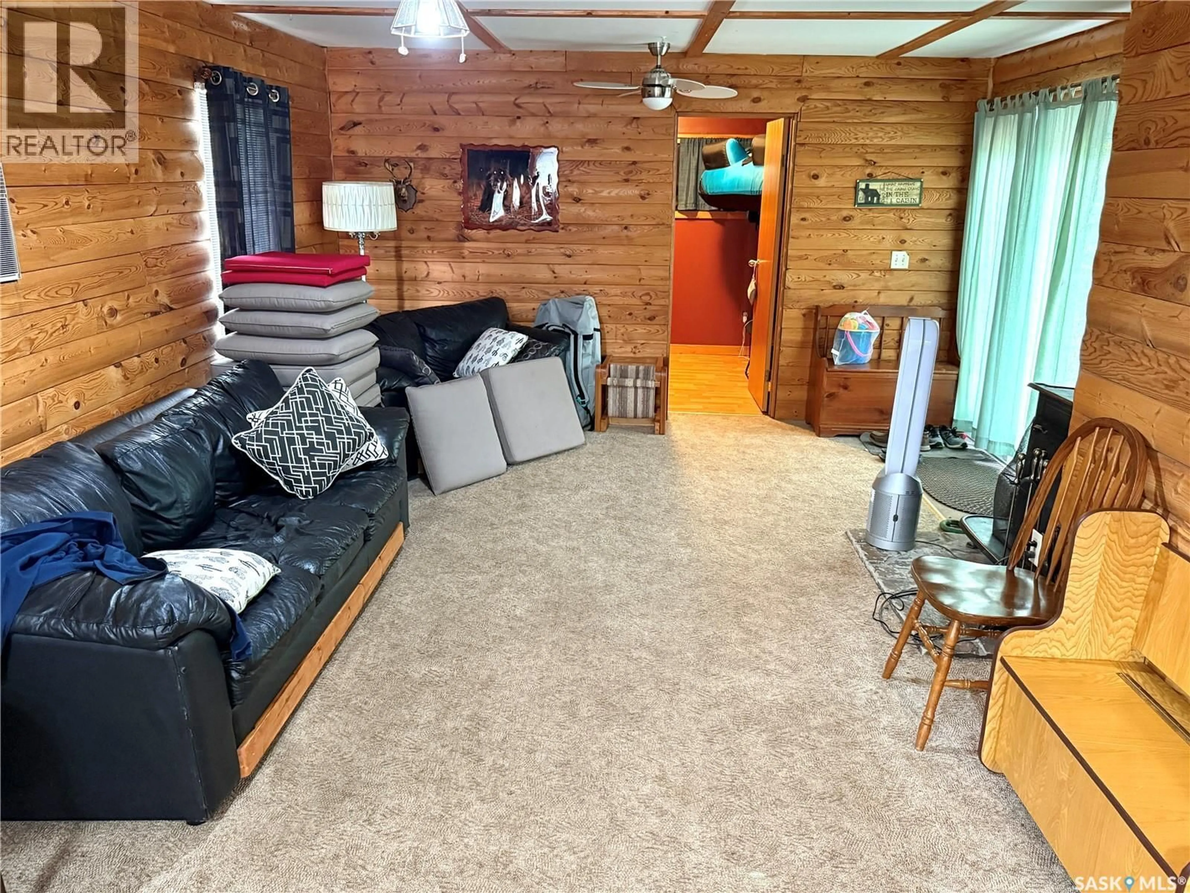 Living room with furniture, wood/laminate floor for 391 MARINER AVENUE, Aquadeo Saskatchewan S0M0L0