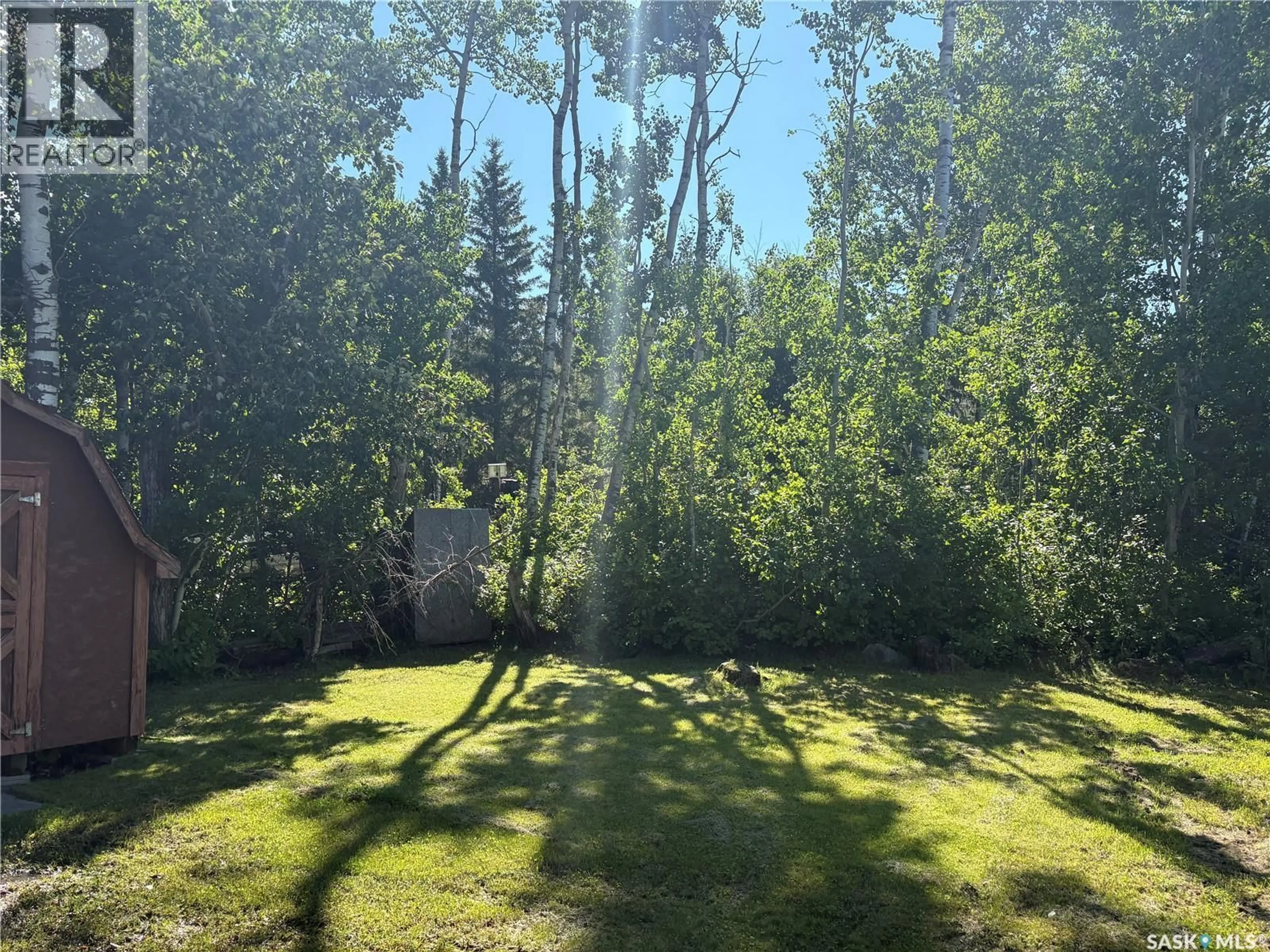 A pic from outside/outdoor area/front of a property/back of a property/a pic from drone, forest/trees view for 9 HUNTER BAY, Fishing Lake Saskatchewan S0A1Y0