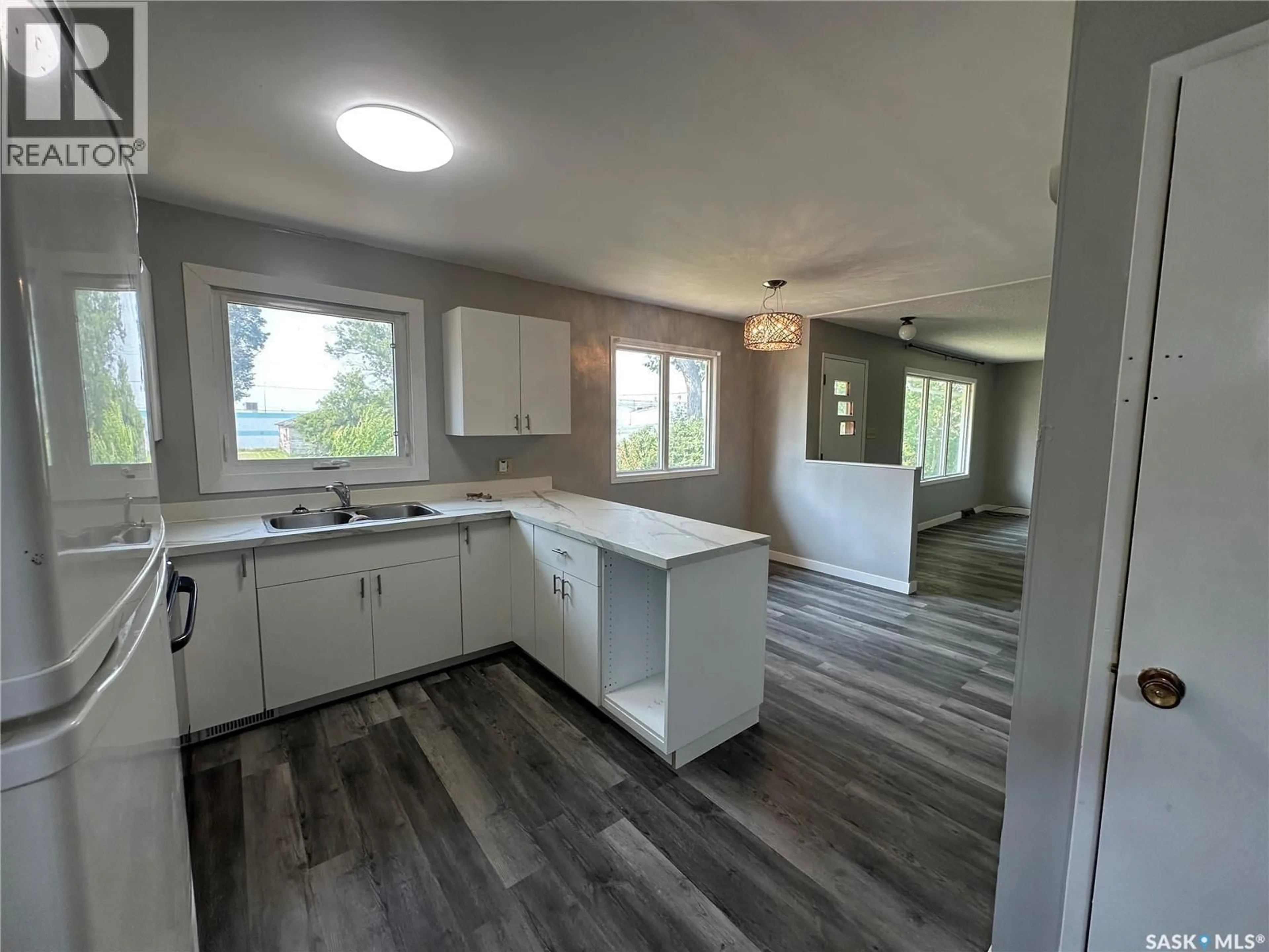 Open concept kitchen, wood/laminate floor for 429 2ND STREET, Kamsack Saskatchewan S0A1S0
