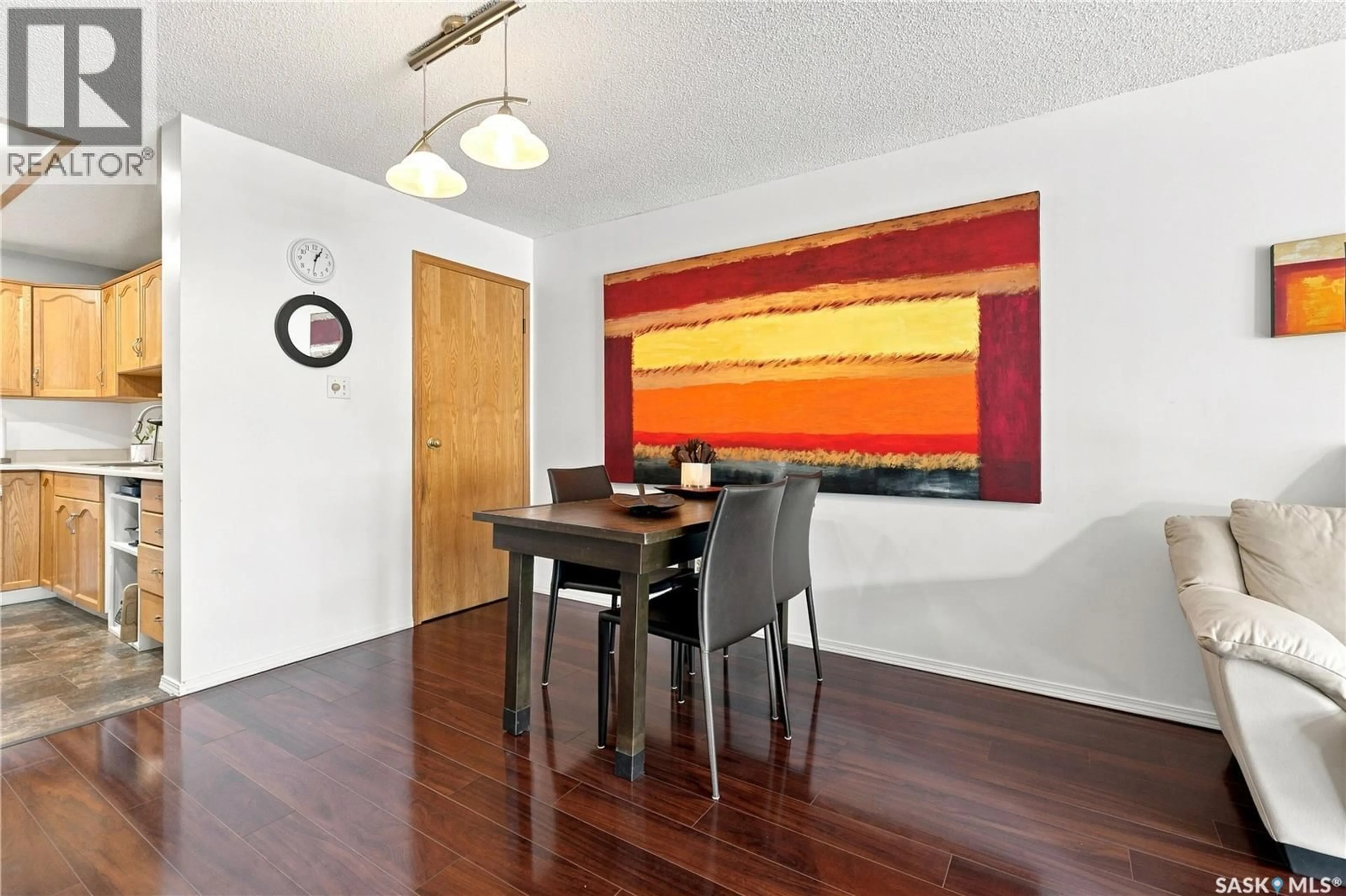 Dining room, wood/laminate floor for 208 - 410 MAIN STREET, Saskatoon Saskatchewan S7N0B8