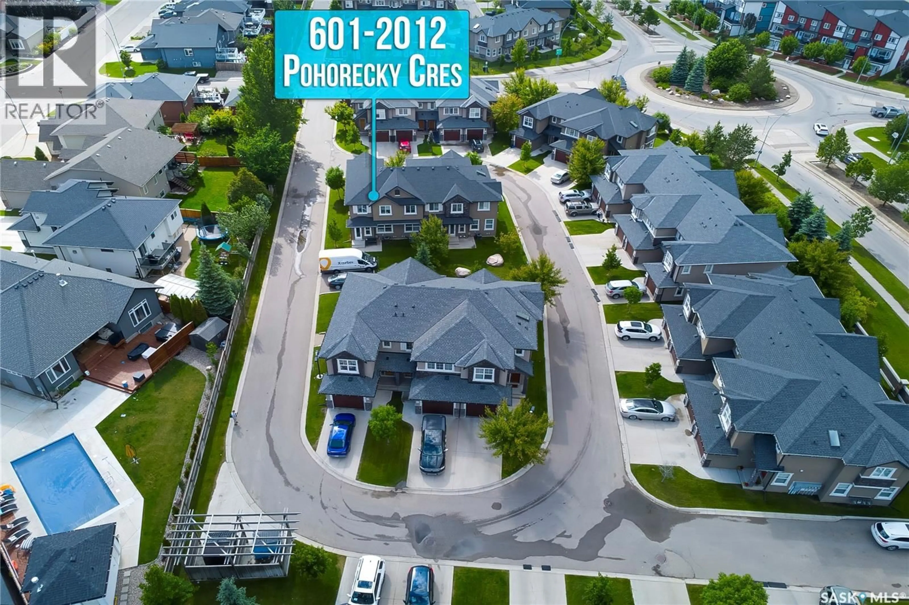A pic from outside/outdoor area/front of a property/back of a property/a pic from drone, street for 2012 - 601 POHORECKY CRESCENT, Saskatoon Saskatchewan S7W0V4