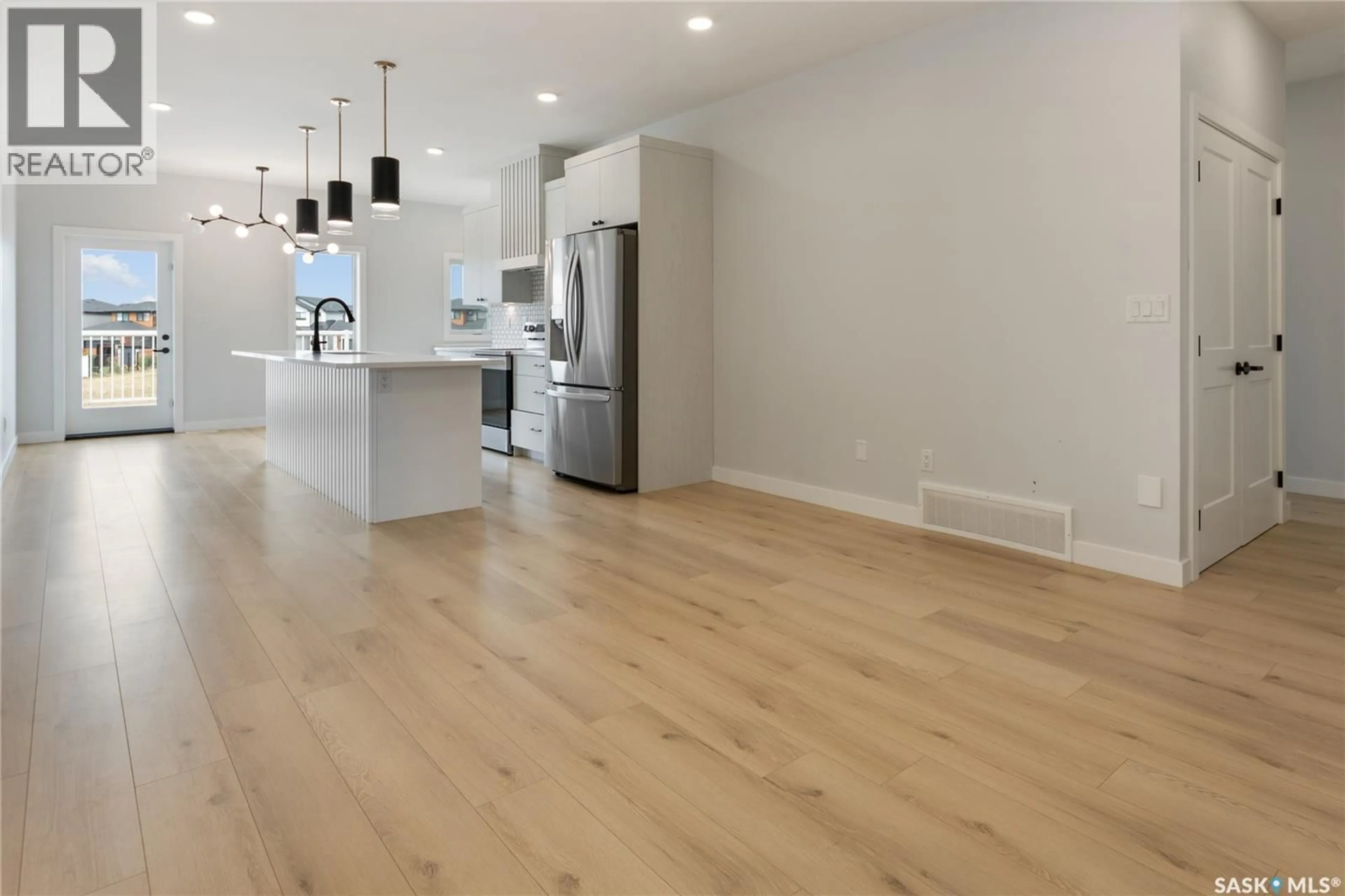 Open concept kitchen, wood/laminate floor for 371 LESKIW BEND, Saskatoon Saskatchewan S7V1R5