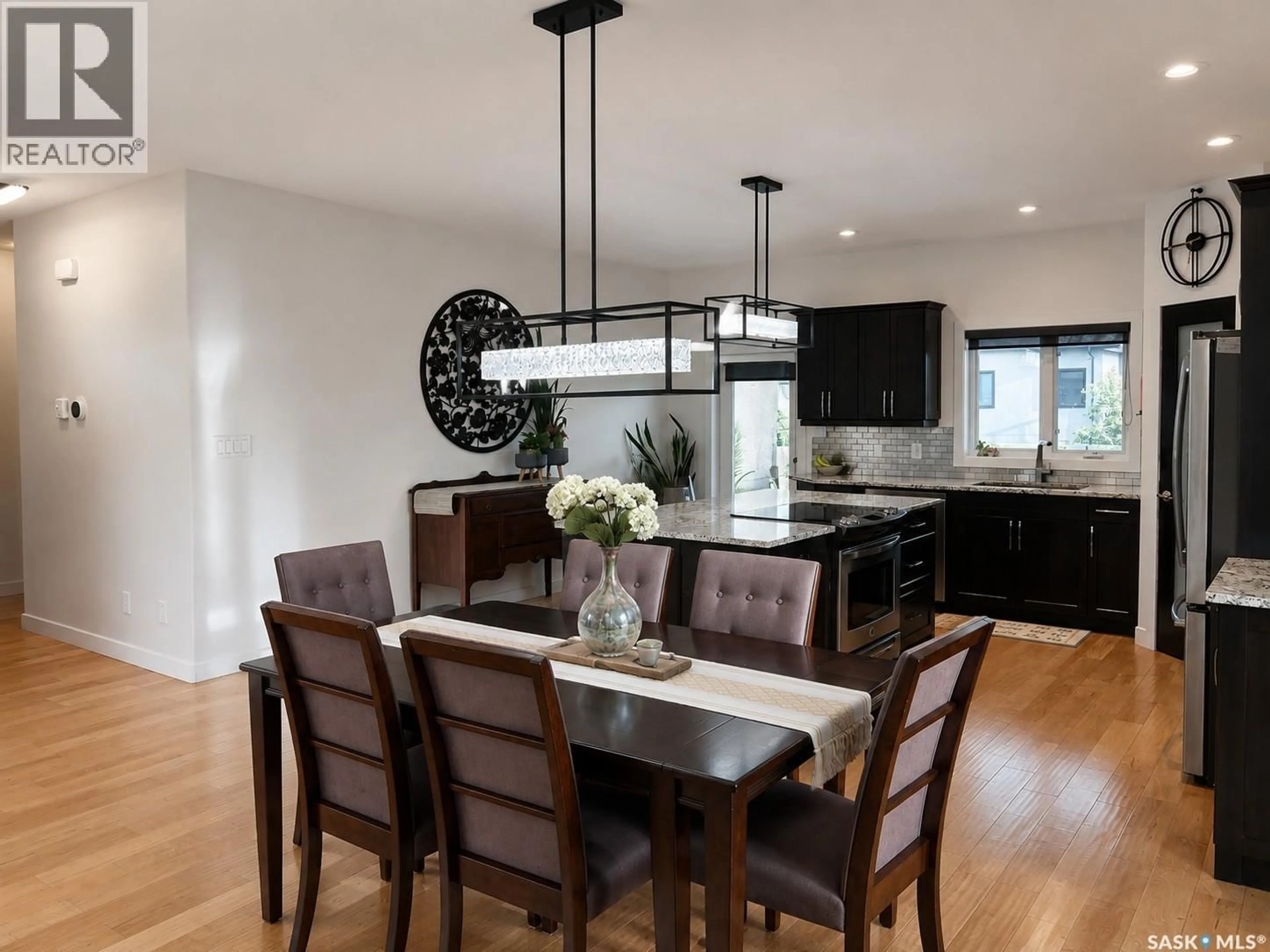 Open concept kitchen, wood/laminate floor for 1 GLEN HOWARD WAY, Prince Albert Saskatchewan S6X0A9
