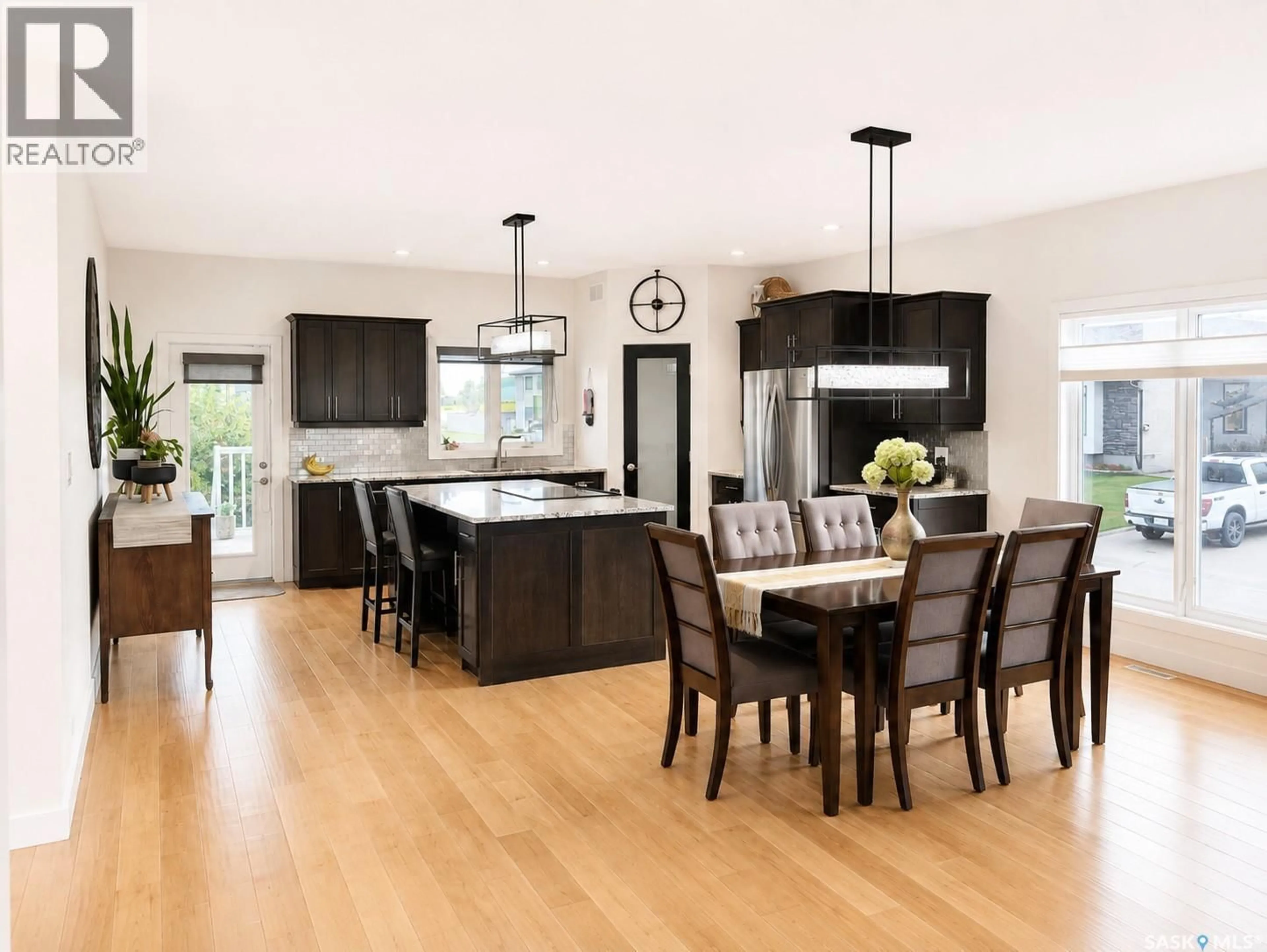 Open concept kitchen, wood/laminate floor for 1 GLEN HOWARD WAY, Prince Albert Saskatchewan S6X0A9