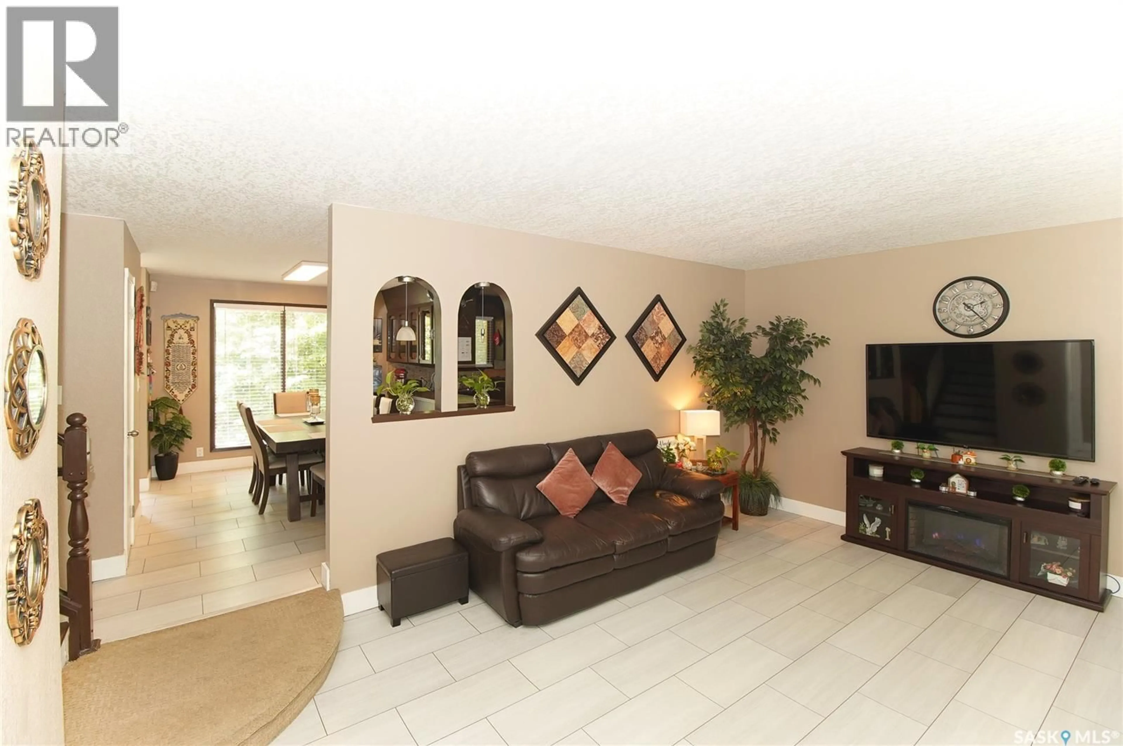 Living room with furniture, ceramic/tile floor for 18 KYLE STREET, Regina Saskatchewan S4R6R6