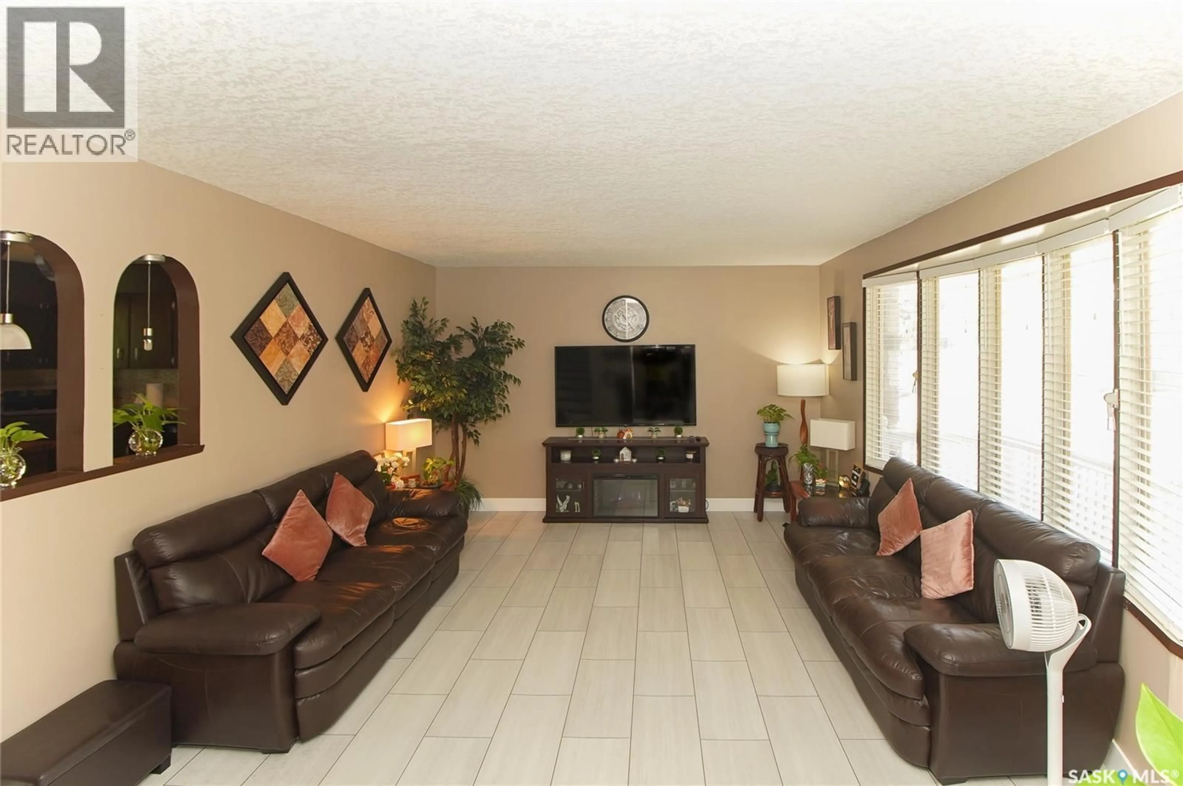 Living room with furniture, ceramic/tile floor for 18 KYLE STREET, Regina Saskatchewan S4R6R6