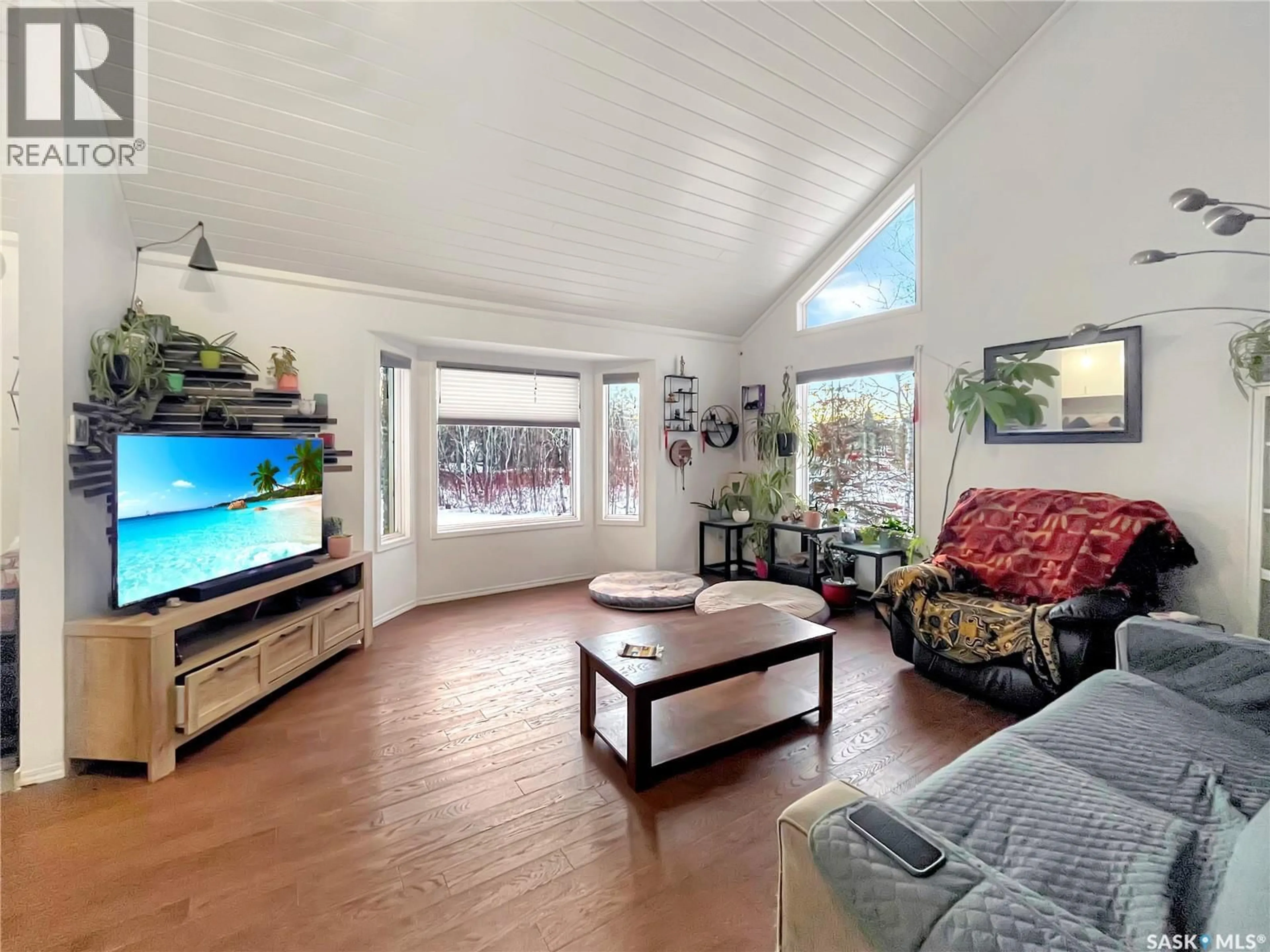 Living room with furniture, wood/laminate floor for 616 BOUNDARY STREET, Buckland Rm No. 491 Saskatchewan S6V0A1