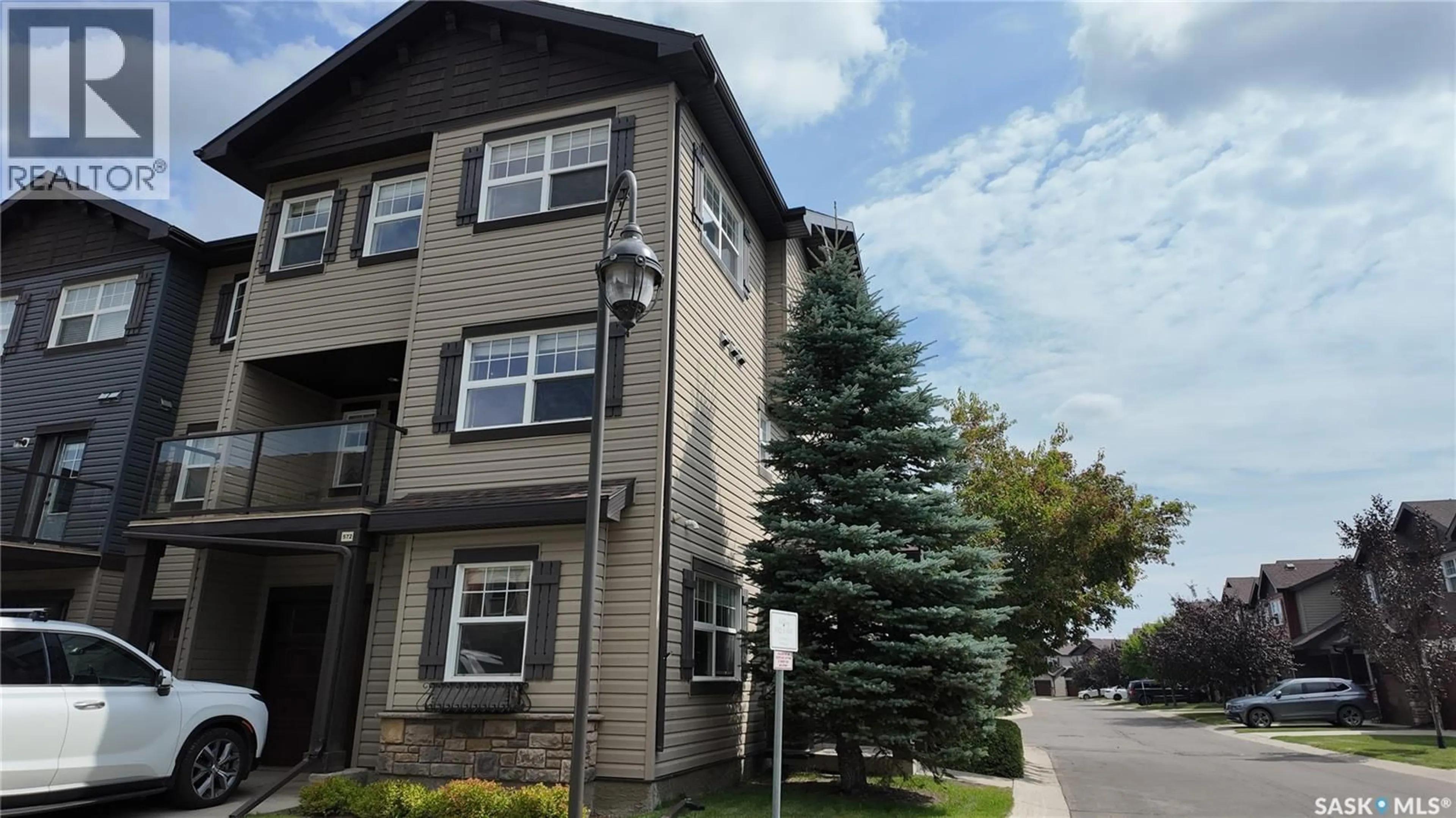 Home with vinyl exterior material, street for 572 150 LANGLOIS WAY, Saskatoon Saskatchewan S7T0L3