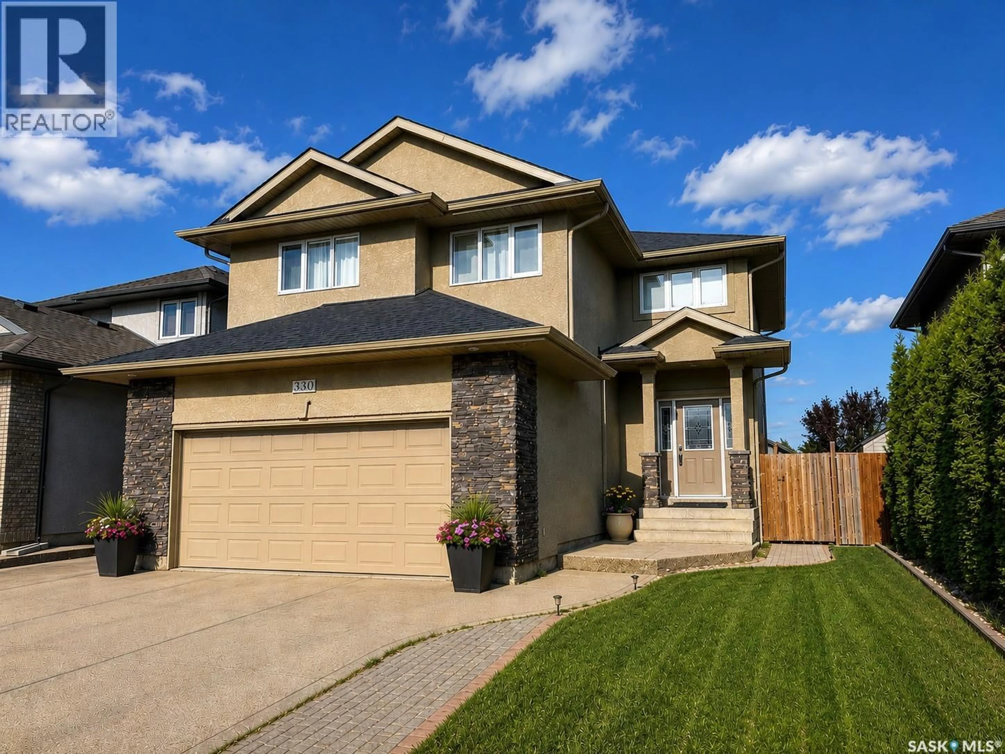 Home with vinyl exterior material, street for 330 BLACKSTOCK COVE, Saskatoon Saskatchewan S7T0H3