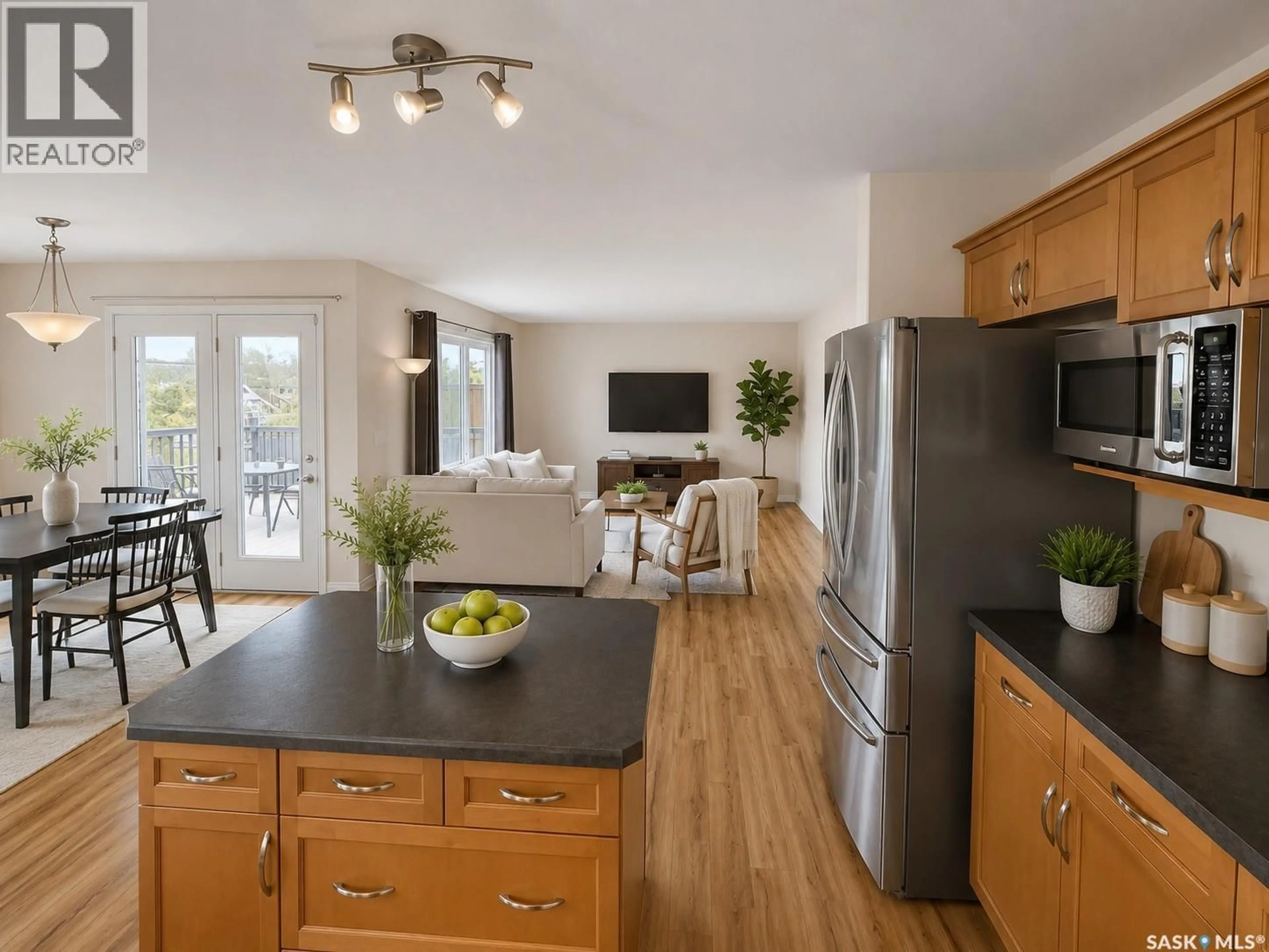 Open concept kitchen, wood/laminate floor for 330 BLACKSTOCK COVE, Saskatoon Saskatchewan S7T0H3