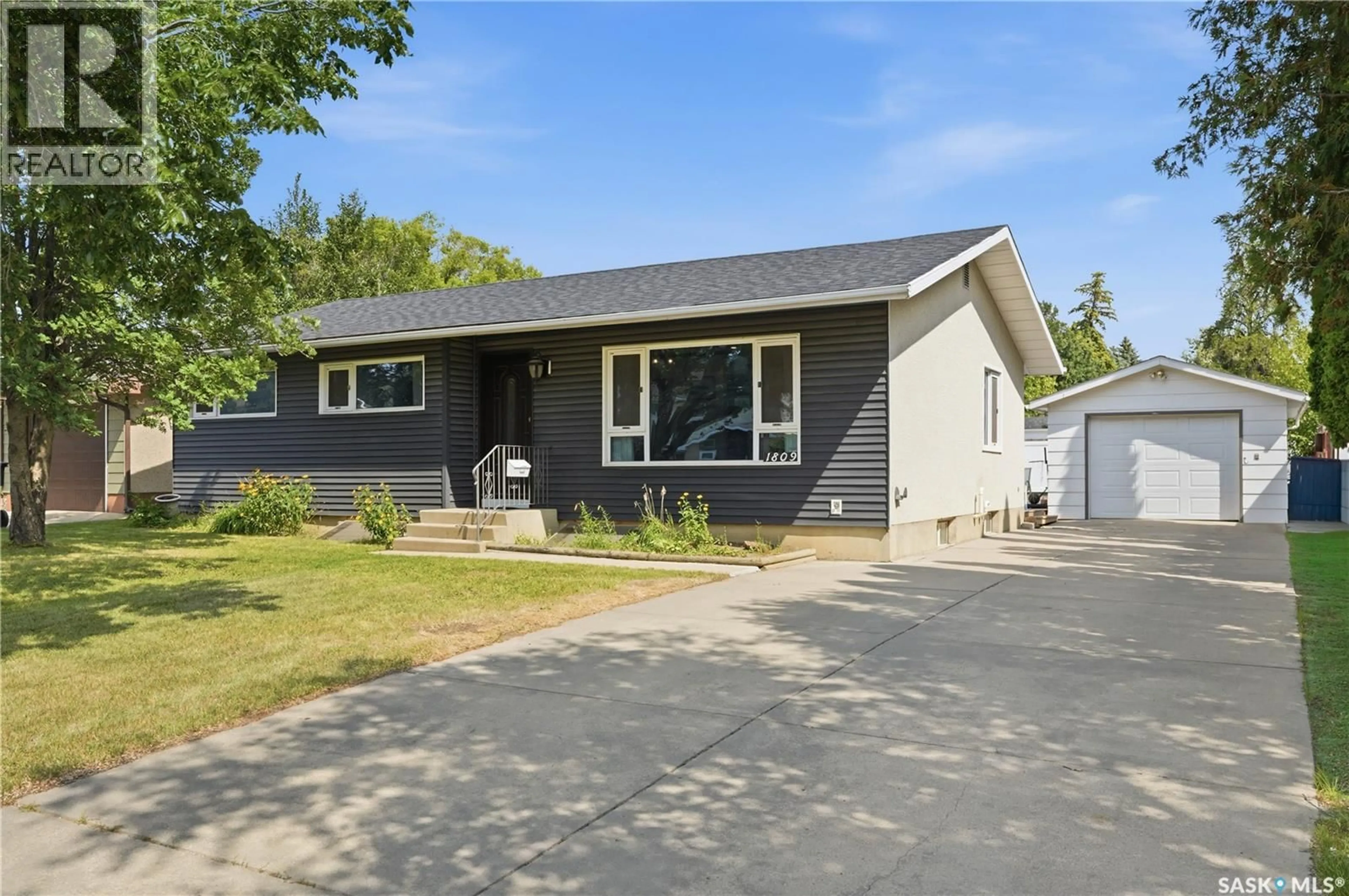 Home with vinyl exterior material, street for 1809 ARLINGTON AVENUE, Saskatoon Saskatchewan S7H2Y8