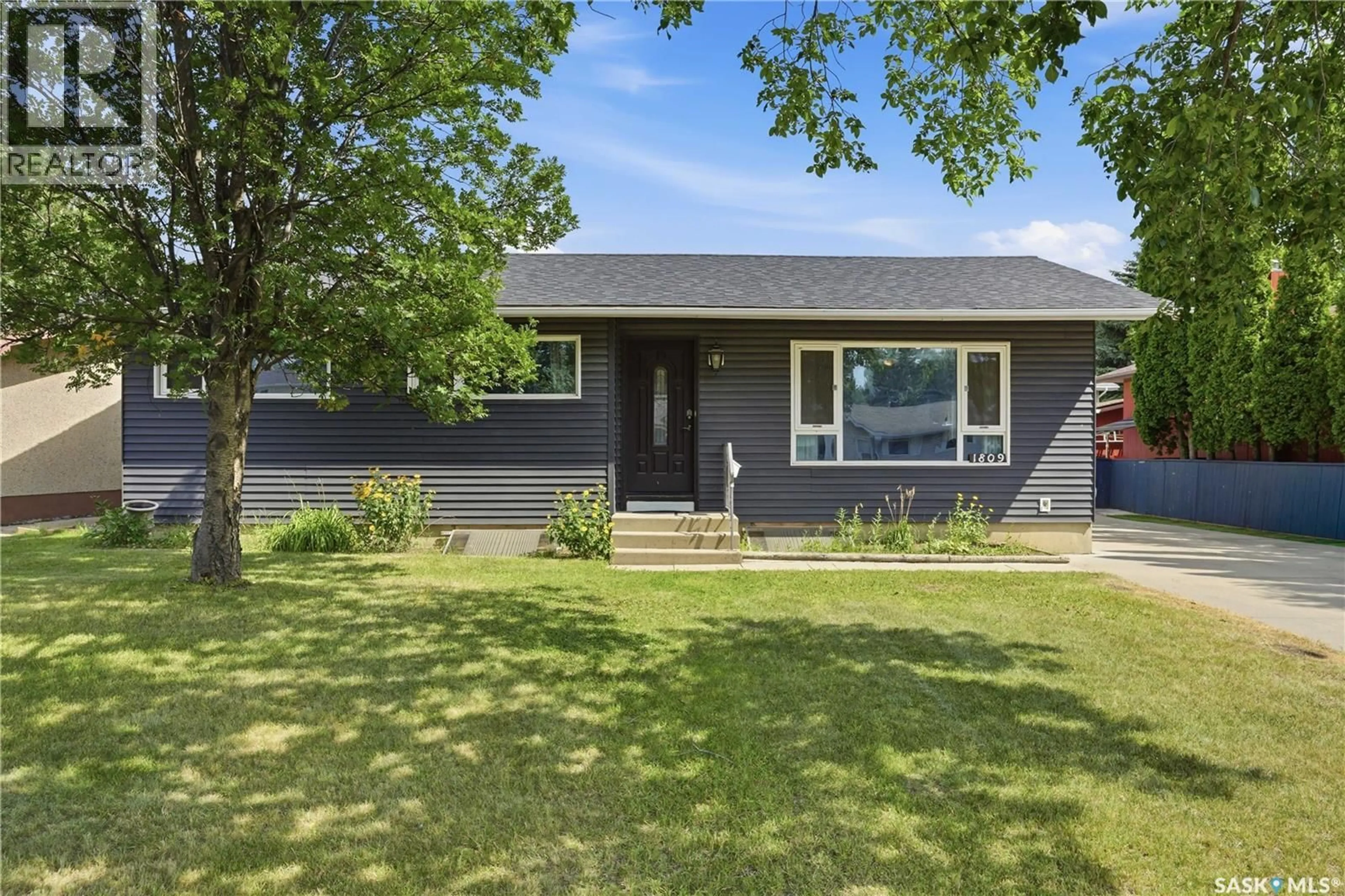 Home with vinyl exterior material, street for 1809 ARLINGTON AVENUE, Saskatoon Saskatchewan S7H2Y8
