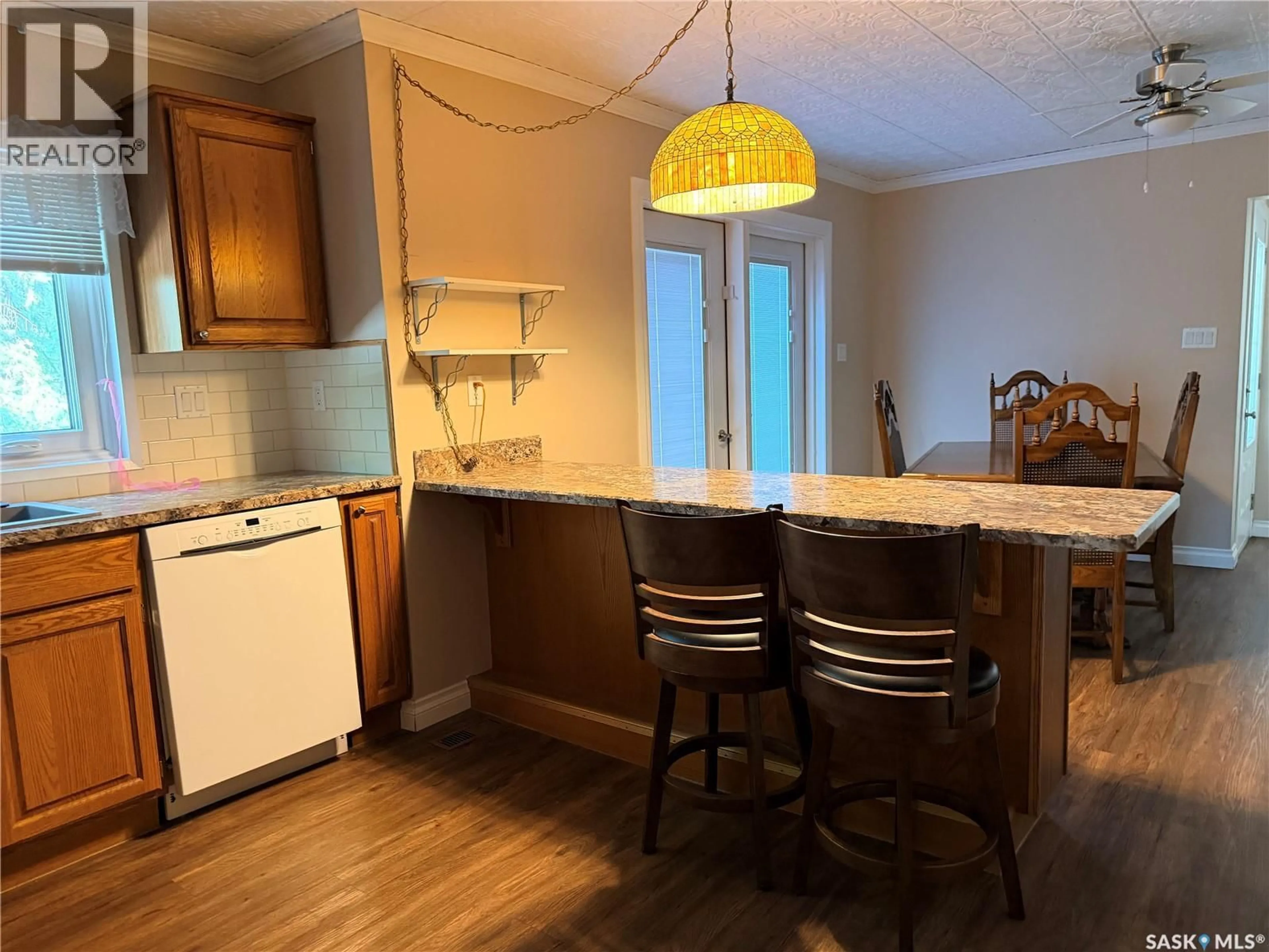 Open concept kitchen, wood/laminate floor for 16 MAIN STREET, Willow Bunch Rm No. 42 Saskatchewan S0H3T0