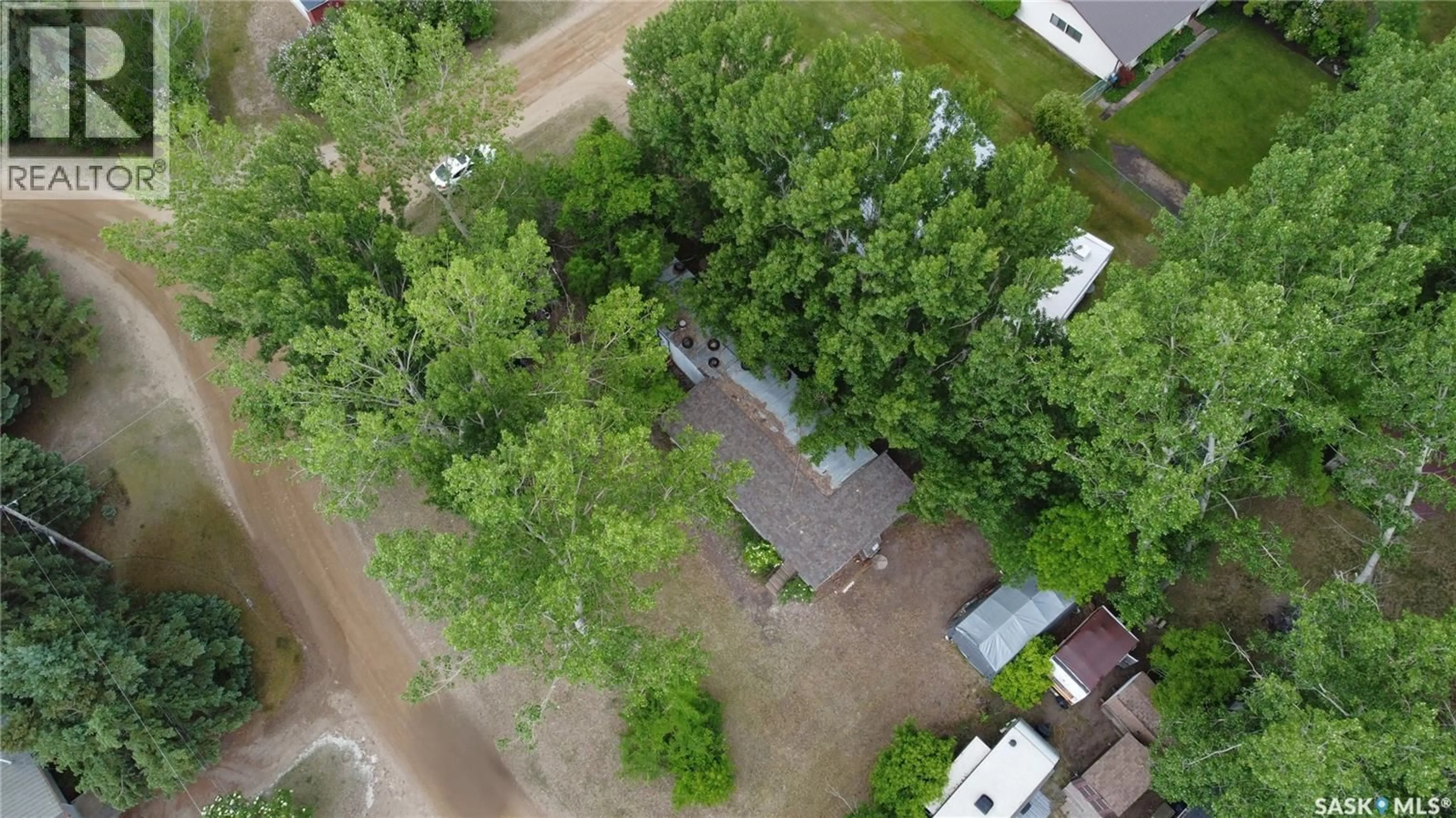 A pic from outside/outdoor area/front of a property/back of a property/a pic from drone, forest/trees view for 414 ZEALANDIA AVENUE, Coteau Beach Saskatchewan S0L0G0