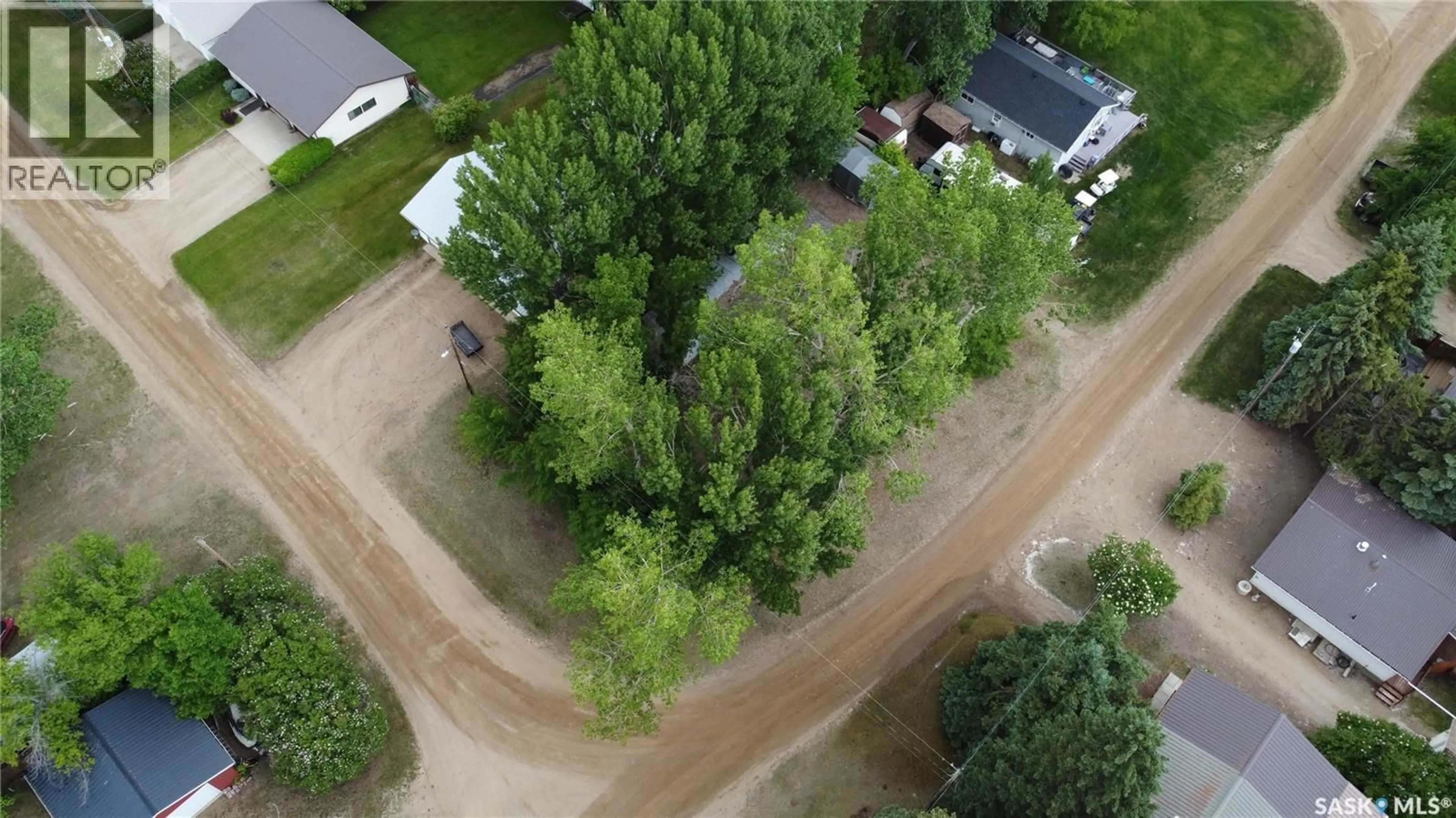 A pic from outside/outdoor area/front of a property/back of a property/a pic from drone, forest/trees view for 414 ZEALANDIA AVENUE, Coteau Beach Saskatchewan S0L0G0