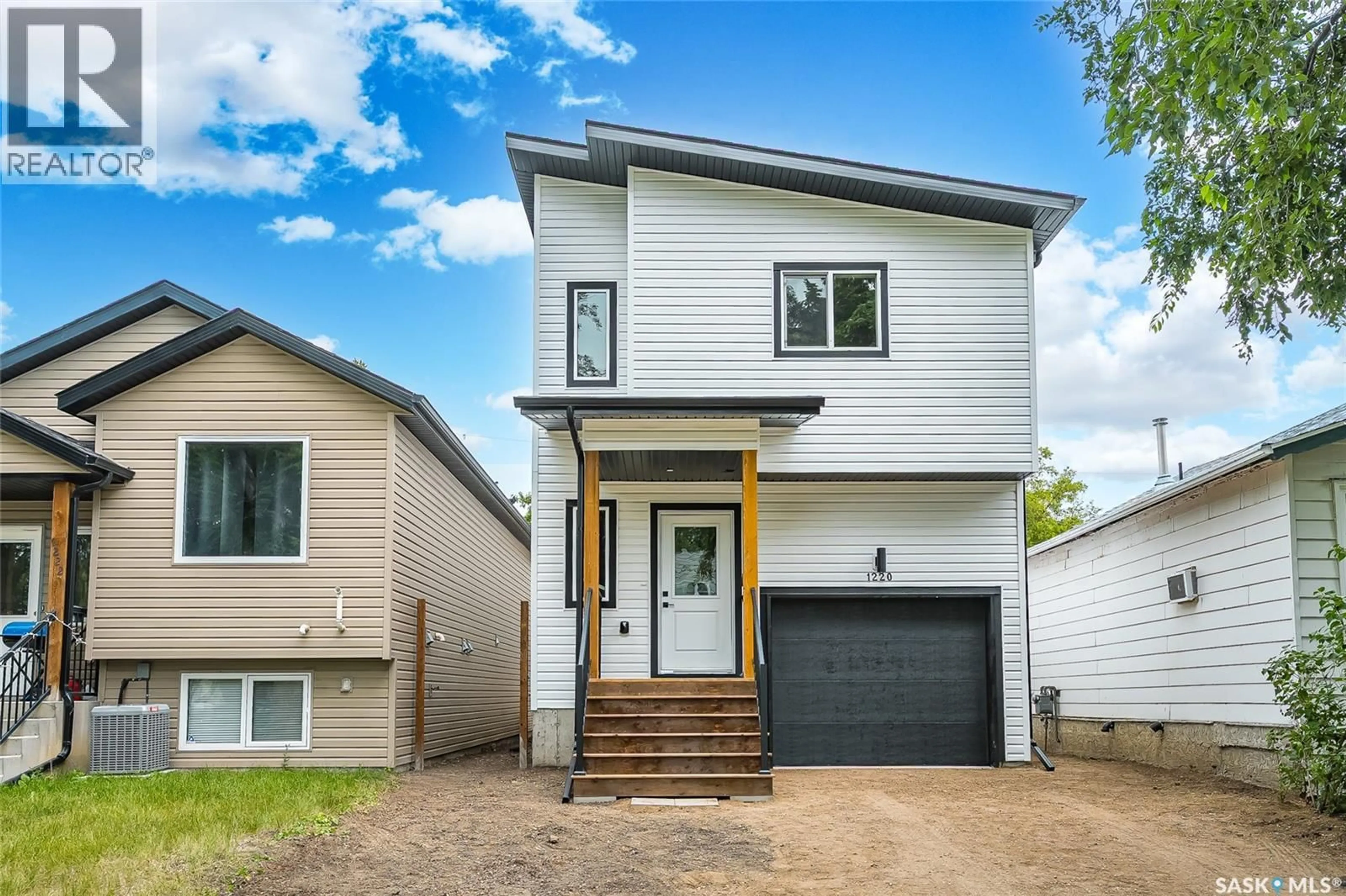 Home with vinyl exterior material, street for 1220 H AVENUE, Saskatoon Saskatchewan S7L2E2
