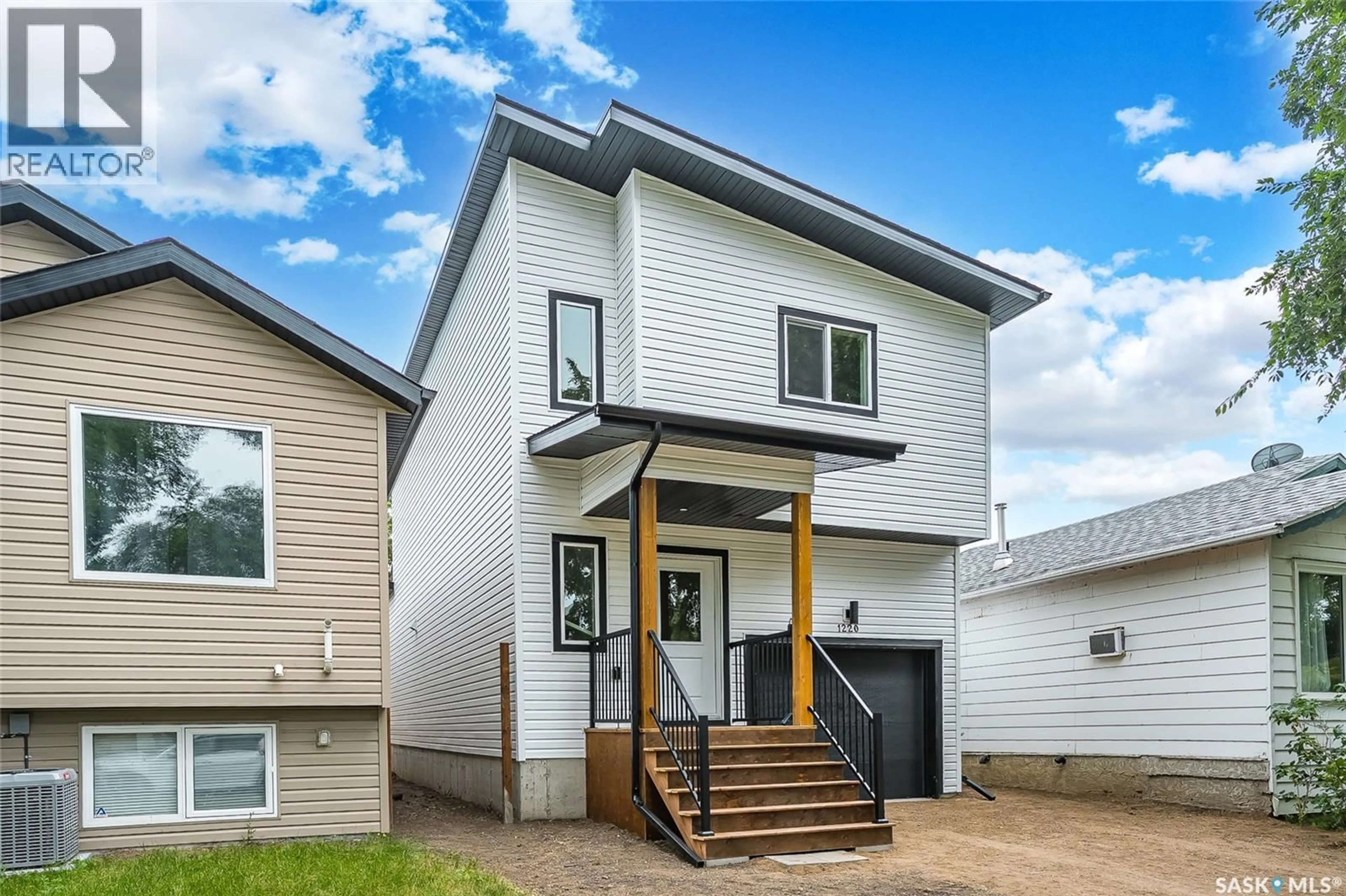 Home with vinyl exterior material, street for 1220 H AVENUE, Saskatoon Saskatchewan S7L2E2
