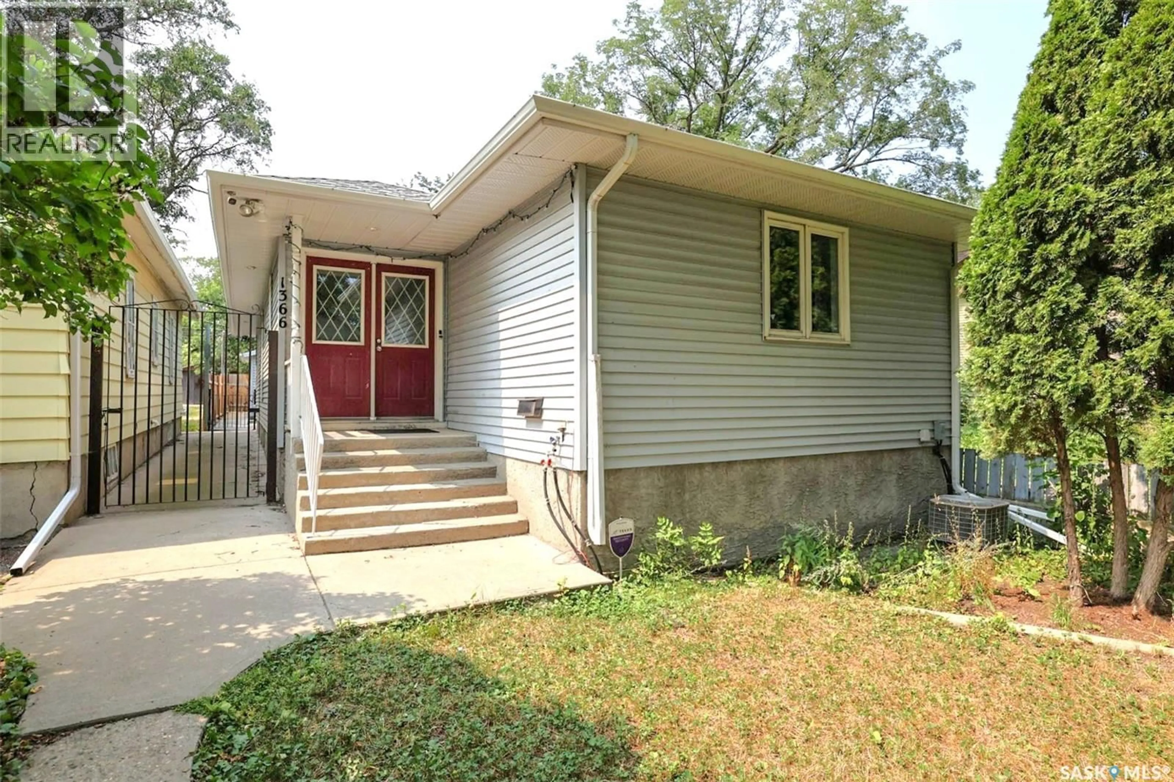 Home with vinyl exterior material, street for 1366 RETALLACK STREET, Regina Saskatchewan S4T2H9
