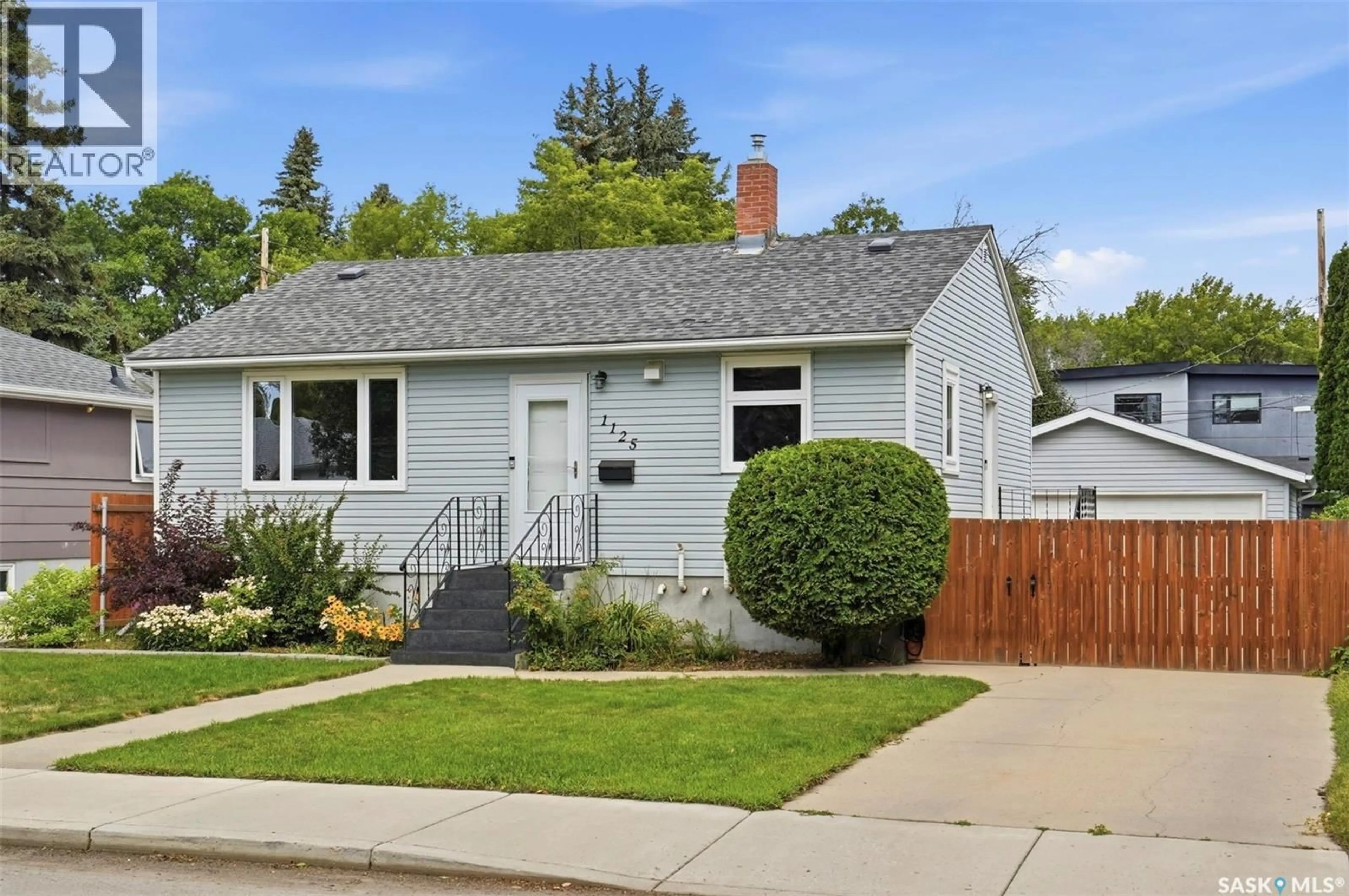Home with vinyl exterior material, street for 1125 2ND STREET E, Saskatoon Saskatchewan S7H1R4