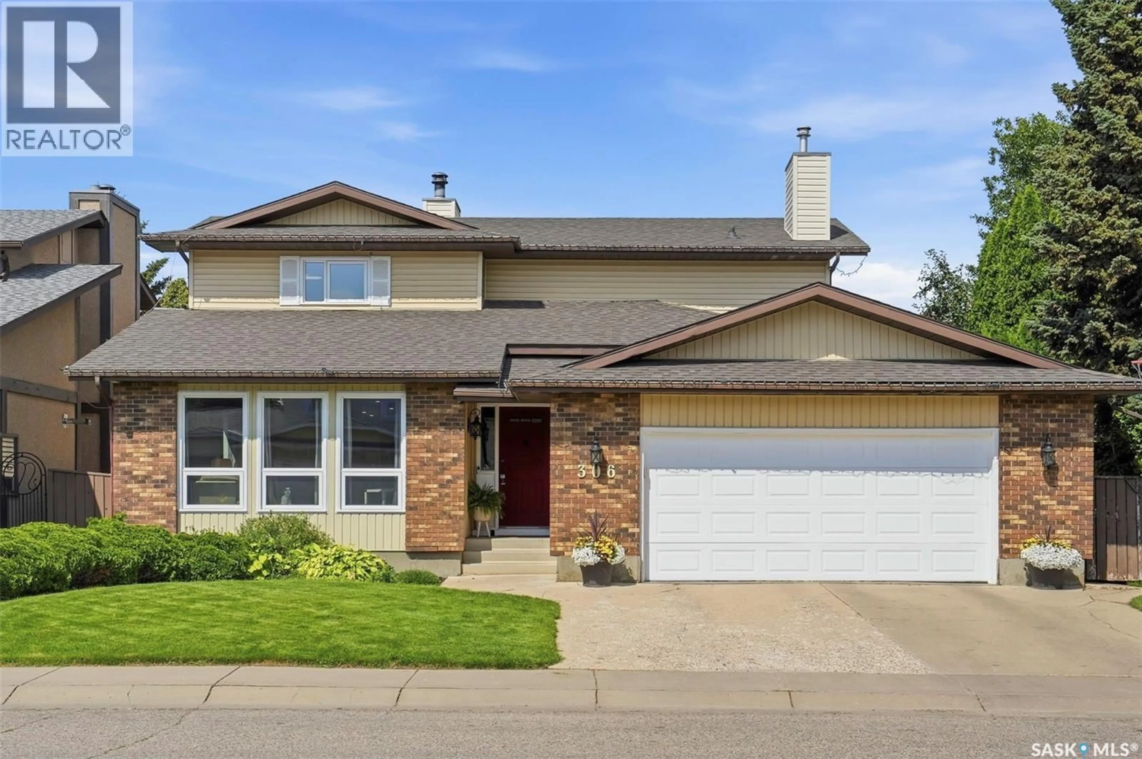 Home with vinyl exterior material, street for 306 WHITEWOOD ROAD, Saskatoon Saskatchewan S7J4L8