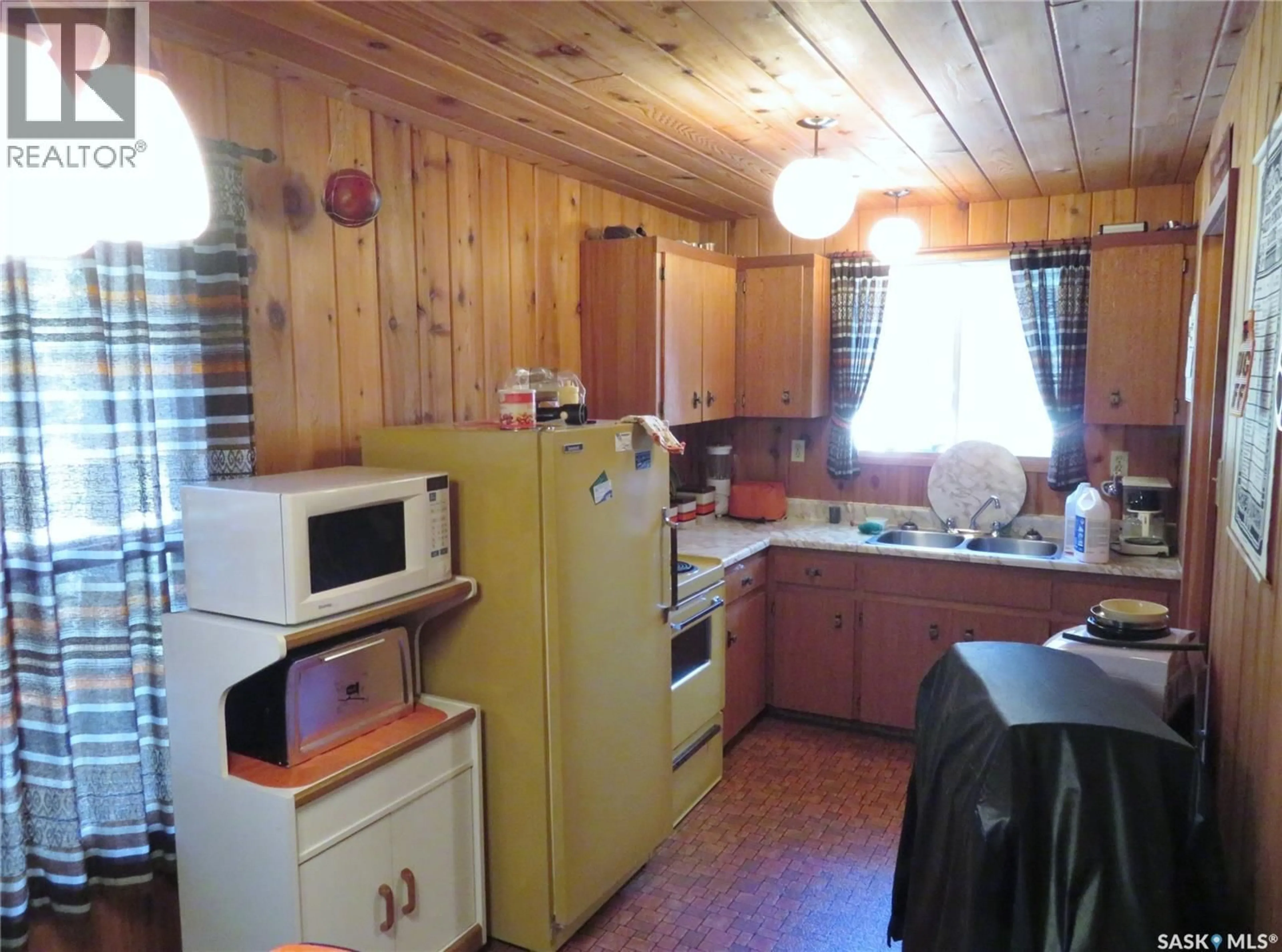 Standard kitchen, wood/laminate floor for 99 CHAMAKESE ROAD, Chitek Lake Saskatchewan S0J0L0
