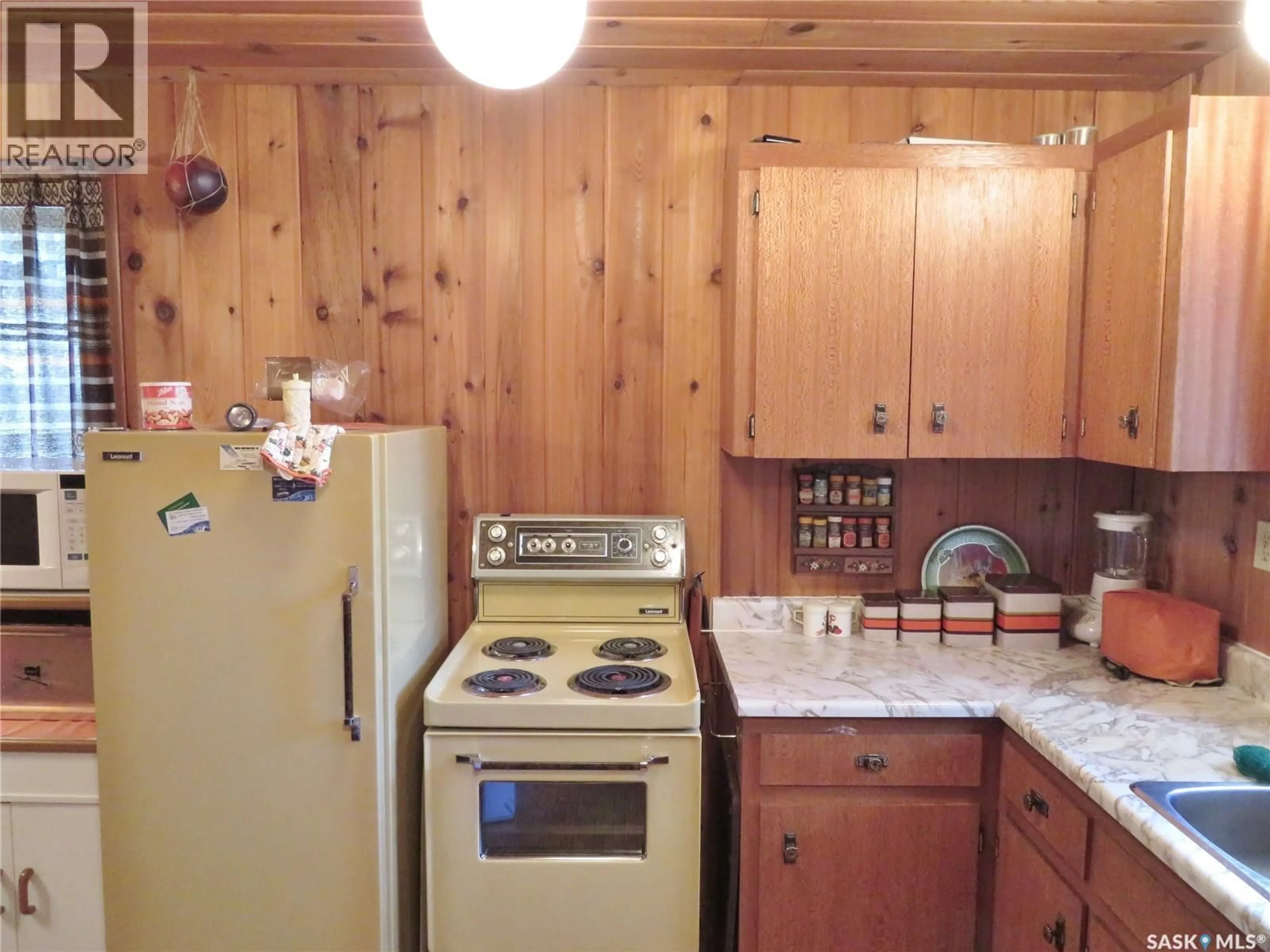 Standard kitchen, wood/laminate floor for 99 CHAMAKESE ROAD, Chitek Lake Saskatchewan S0J0L0