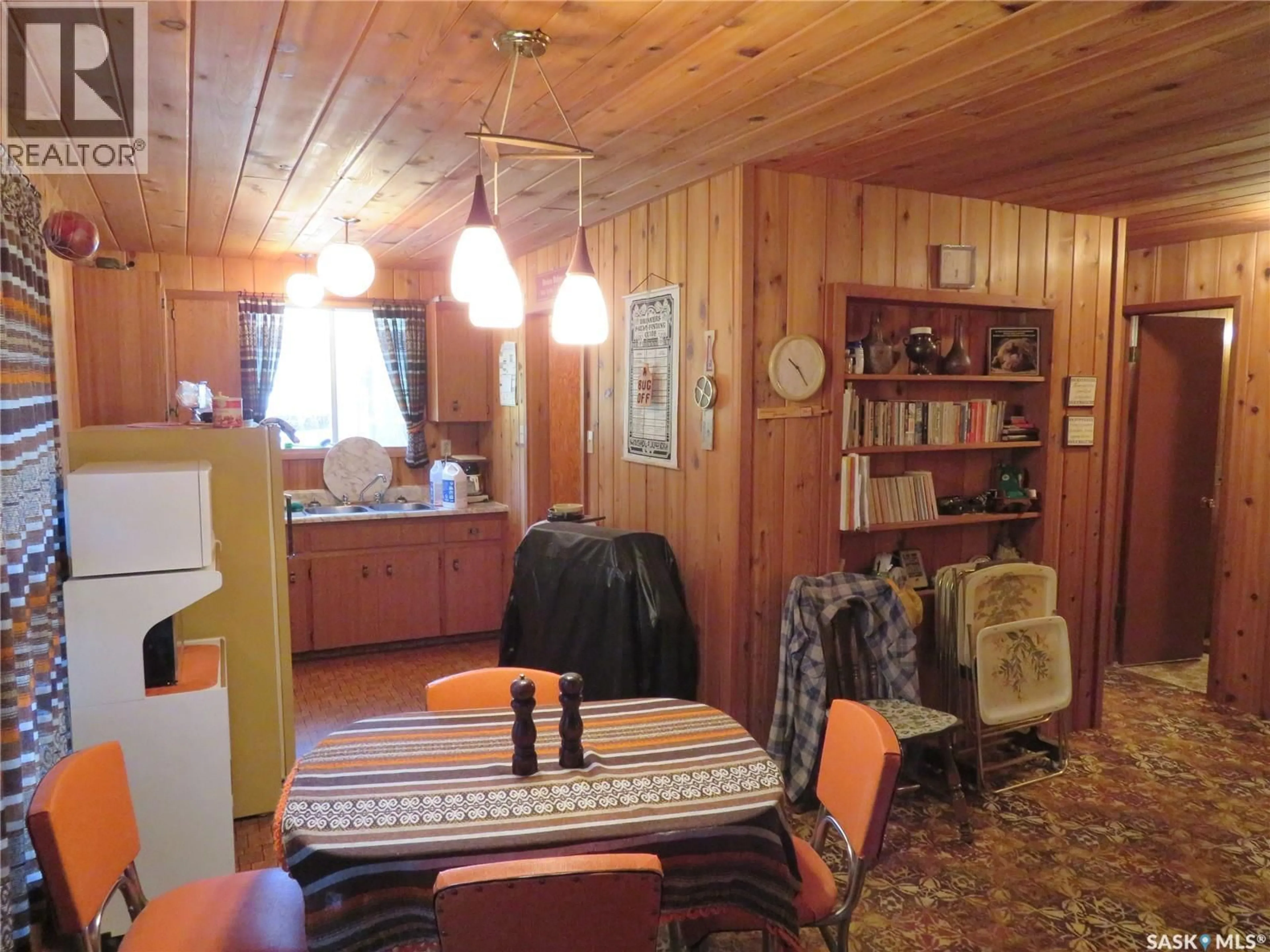 Dining room, wood/laminate floor for 99 CHAMAKESE ROAD, Chitek Lake Saskatchewan S0J0L0