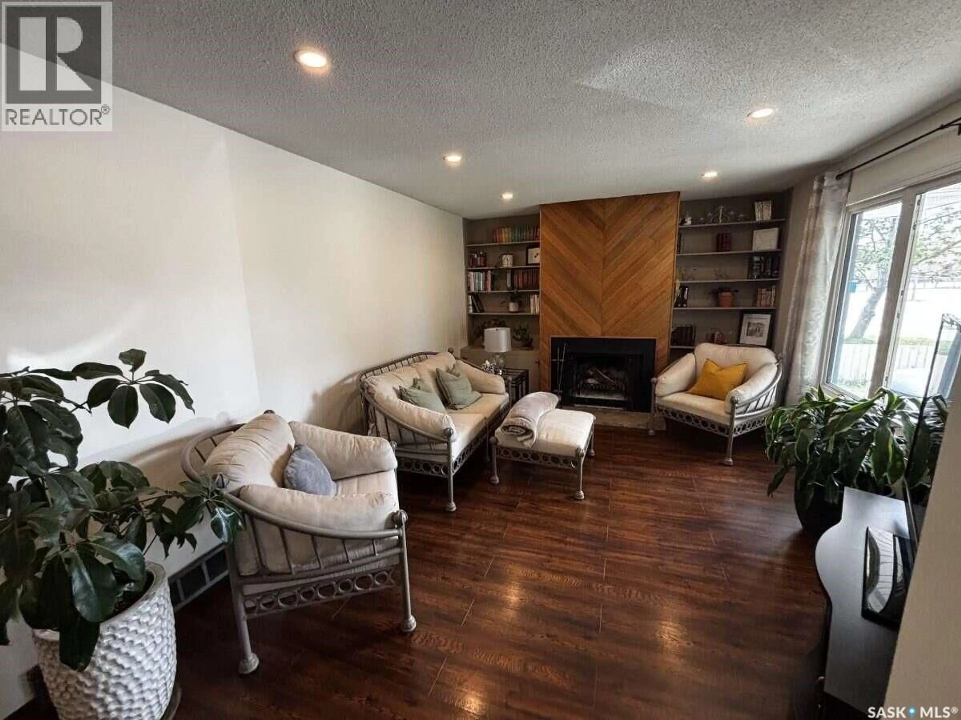Living room with furniture, wood/laminate floor for 195 WELLS STREET, Regina Saskatchewan S4R5Z6