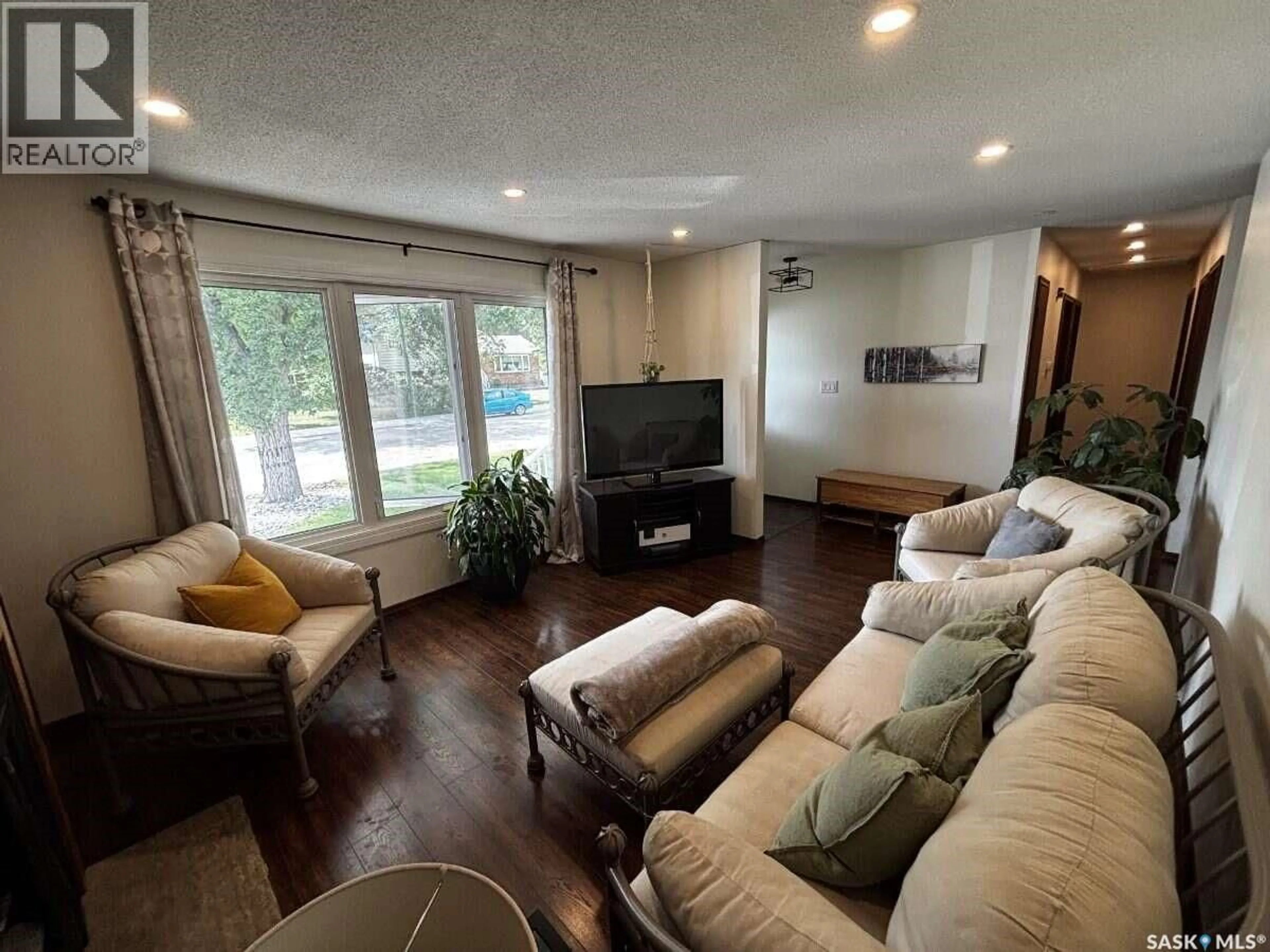 Living room with furniture, wood/laminate floor for 195 WELLS STREET, Regina Saskatchewan S4R5Z6