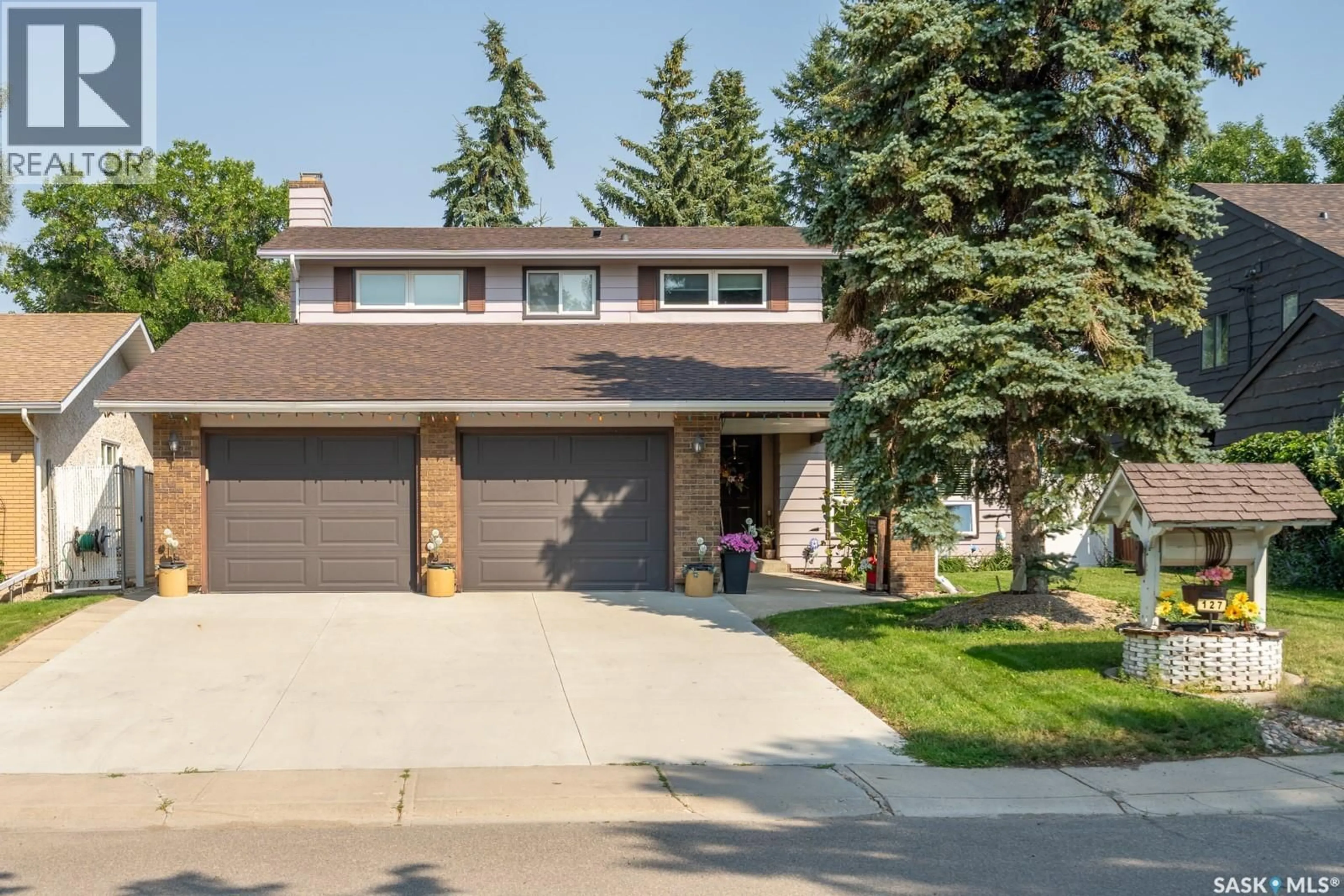 Home with vinyl exterior material, street for 127 ROGERS ROAD, Regina Saskatchewan S4S6T7