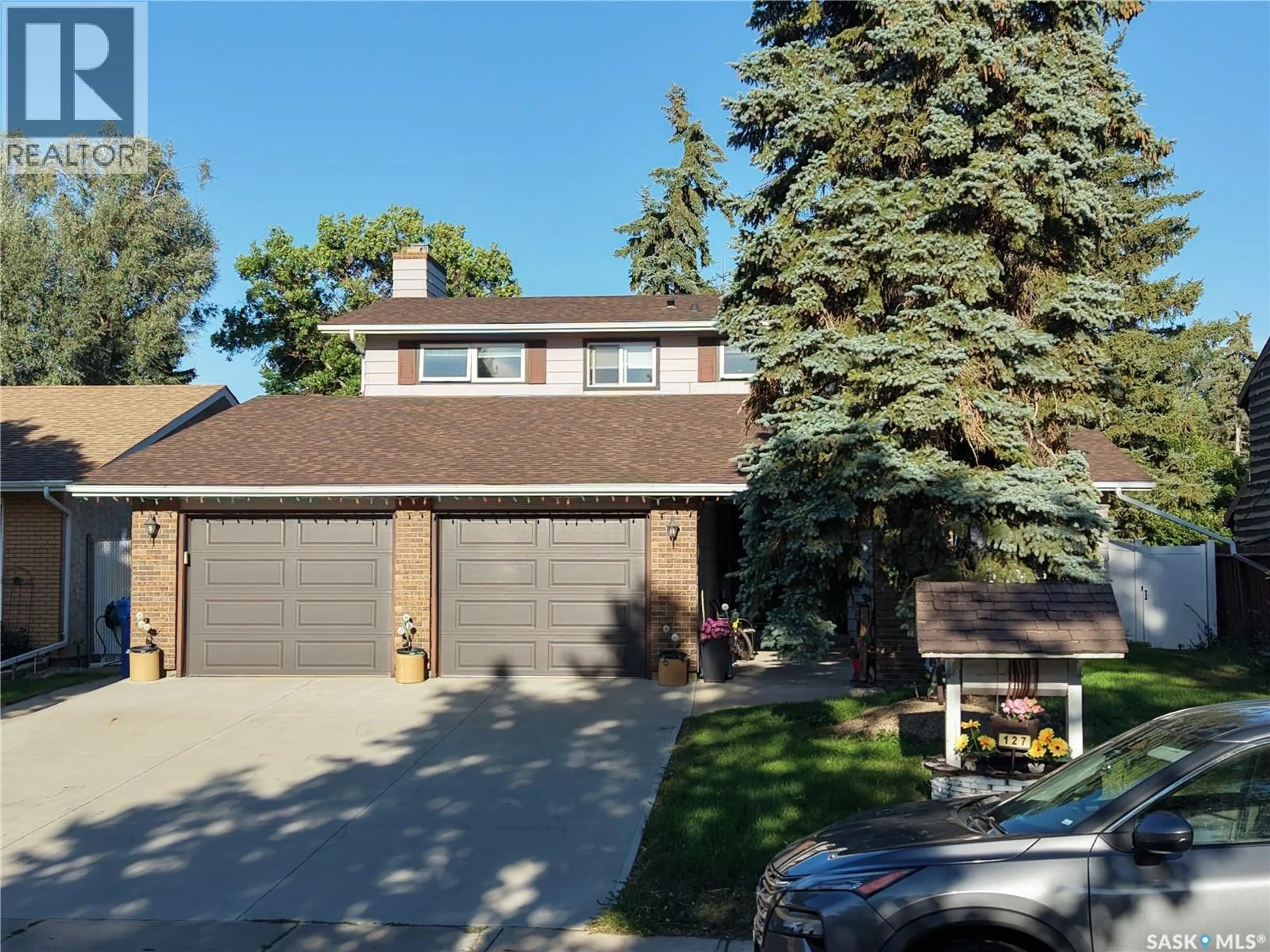 Home with vinyl exterior material, street for 127 ROGERS ROAD, Regina Saskatchewan S4S6T7