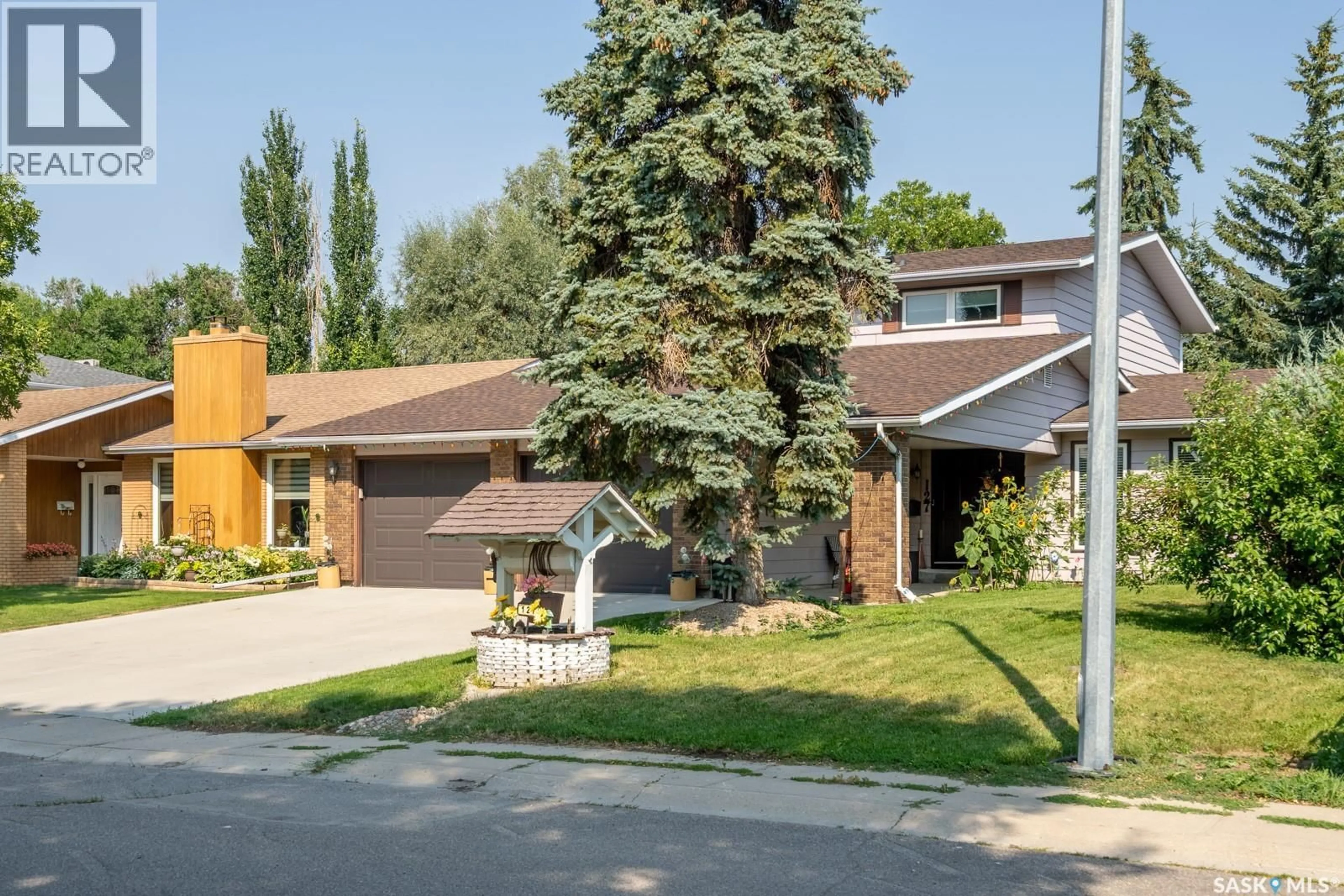 Home with brick exterior material, street for 127 ROGERS ROAD, Regina Saskatchewan S4S6T7