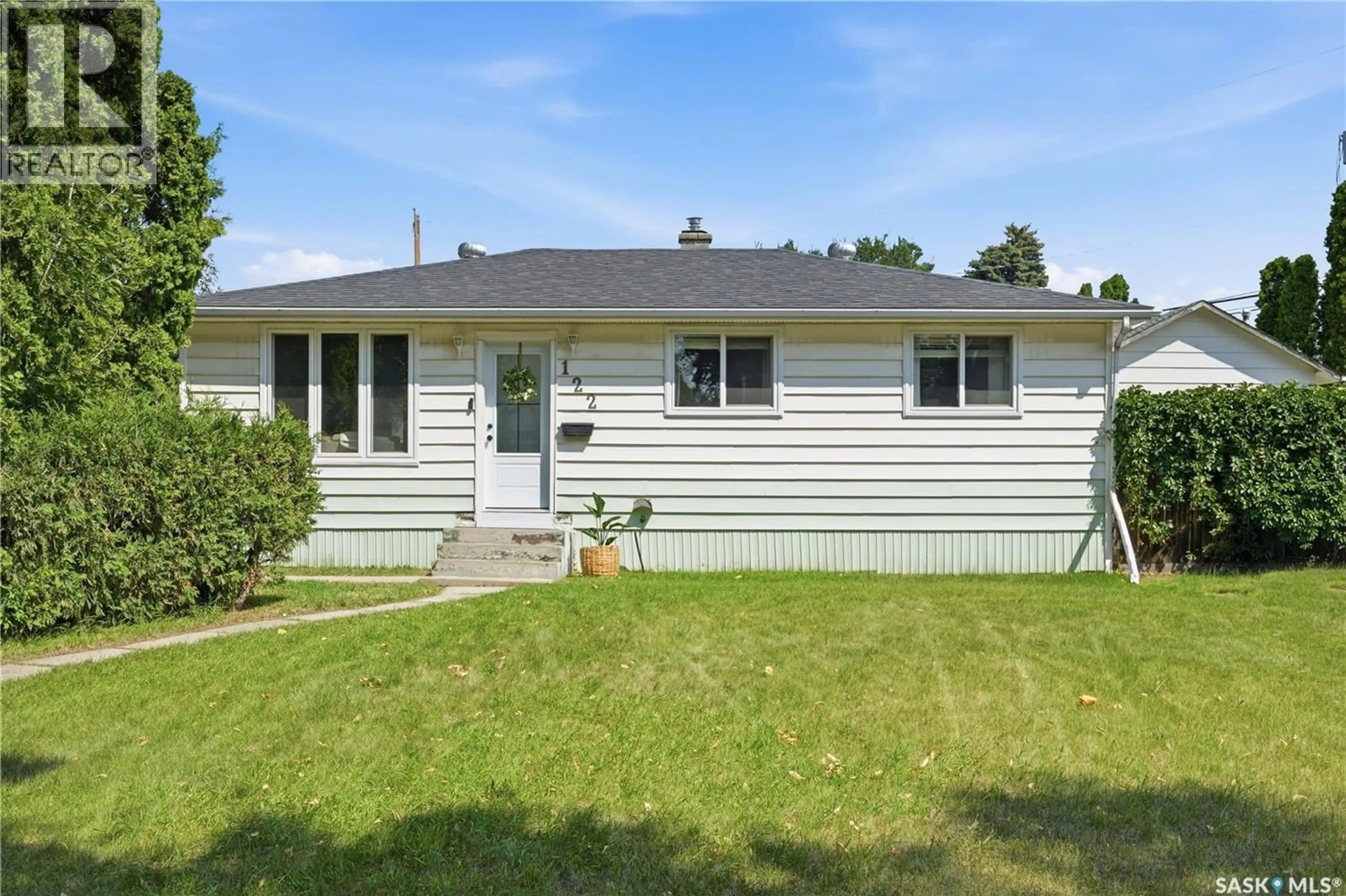 Home with vinyl exterior material, street for 122 MONTREAL AVENUE, Saskatoon Saskatchewan S7M3K8