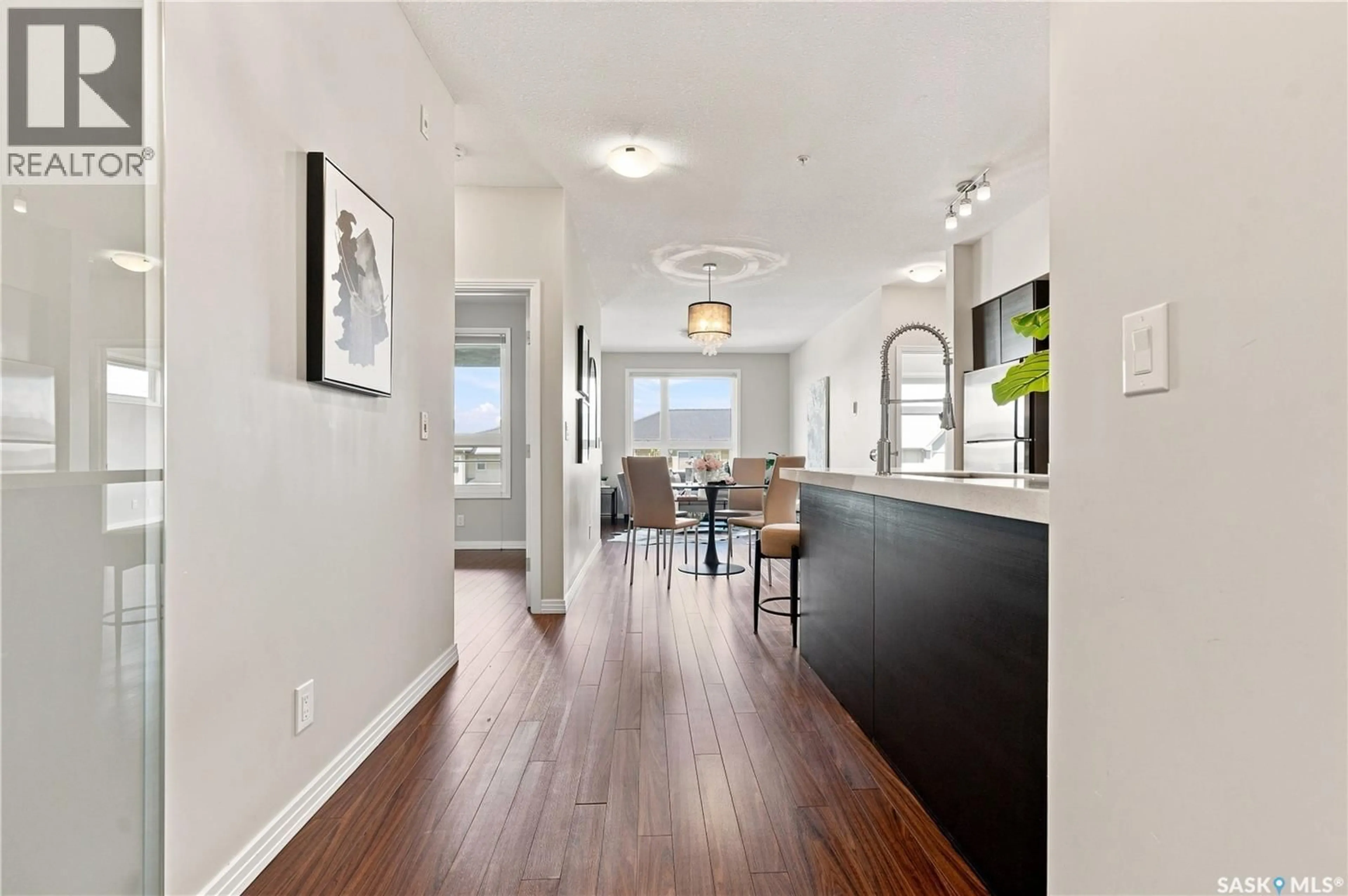 Open concept kitchen, wood/laminate floor for 225 - 206 MANINGAS BEND, Saskatoon Saskatchewan S7W0P9