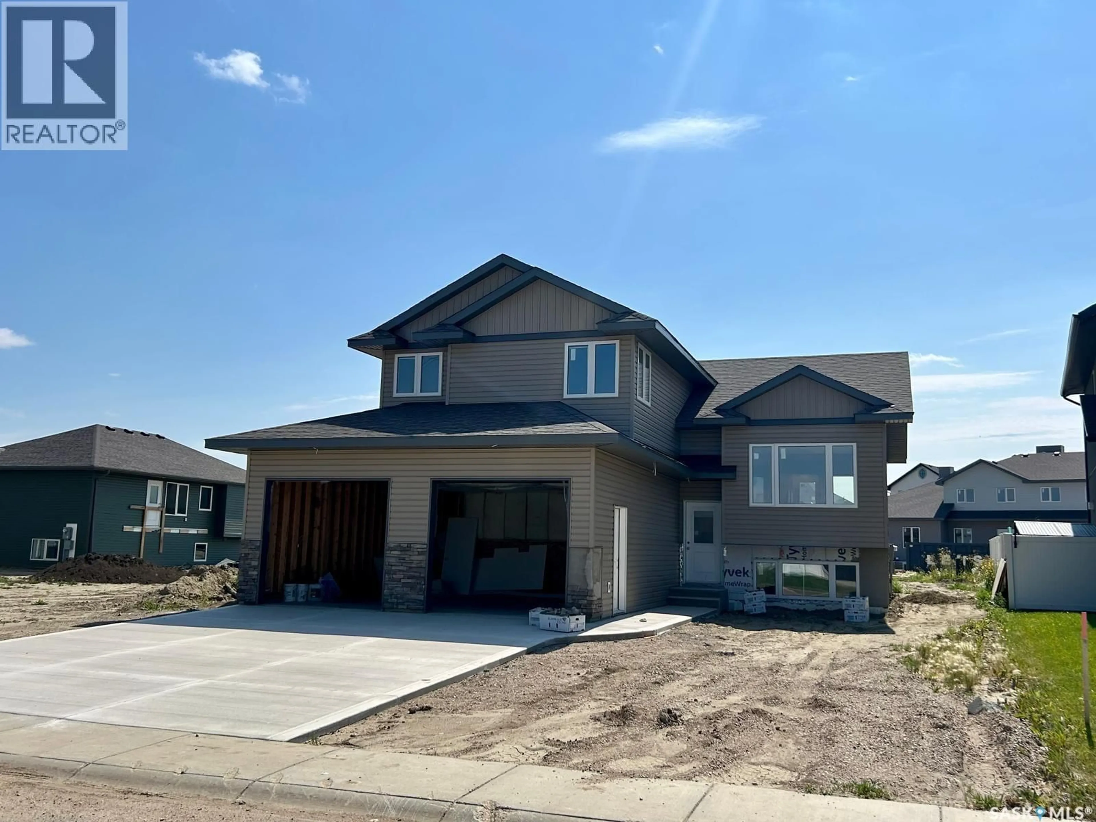 Home with vinyl exterior material, street for 408 PRAIRIE VIEW DRIVE, Dundurn Saskatchewan S0K1K1