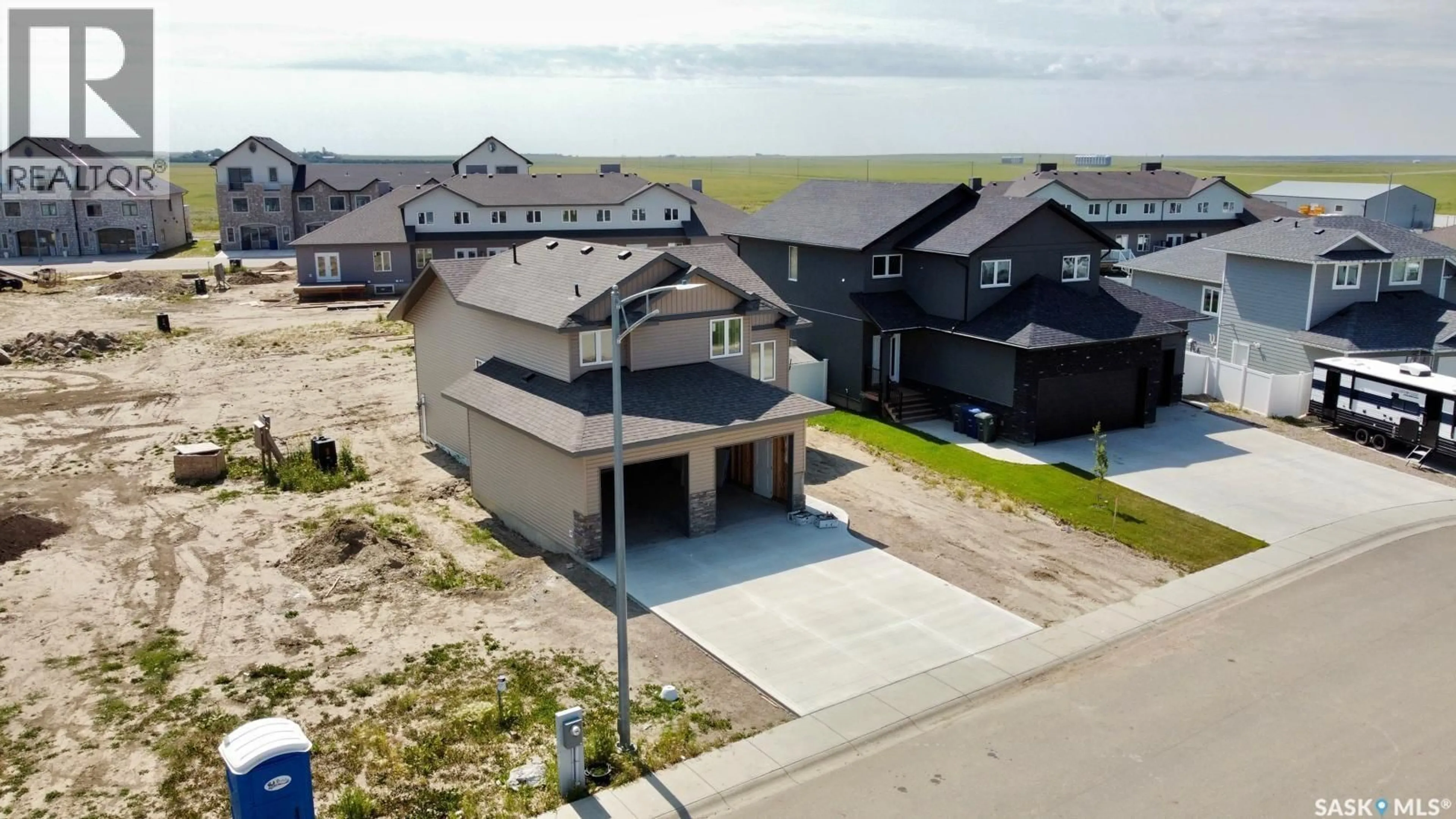 A pic from outside/outdoor area/front of a property/back of a property/a pic from drone, water/lake/river/ocean view for 408 PRAIRIE VIEW DRIVE, Dundurn Saskatchewan S0K1K1