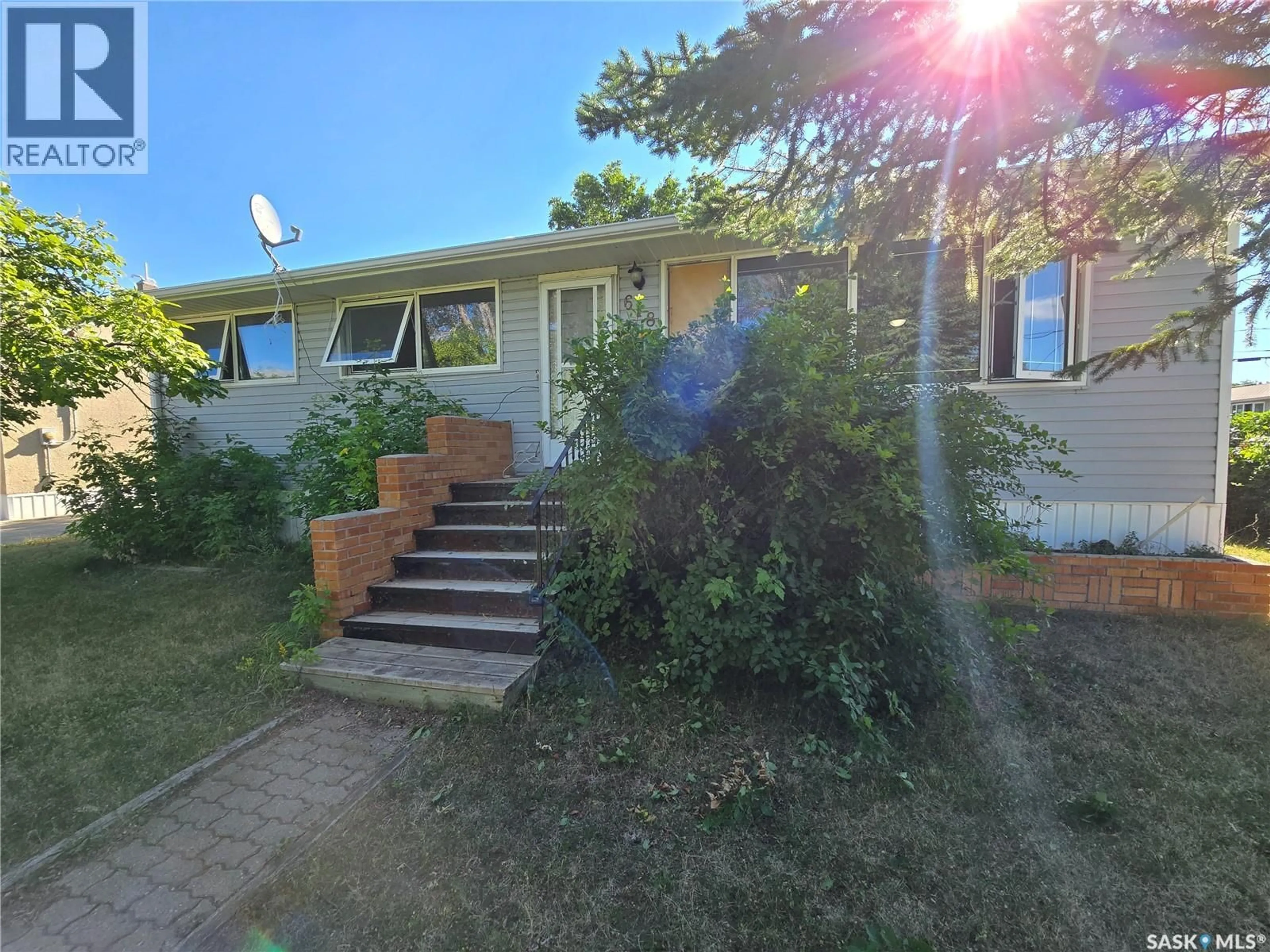 A pic from outside/outdoor area/front of a property/back of a property/a pic from drone, street for 618 3RD STREET, Weyburn Saskatchewan S4H2E1