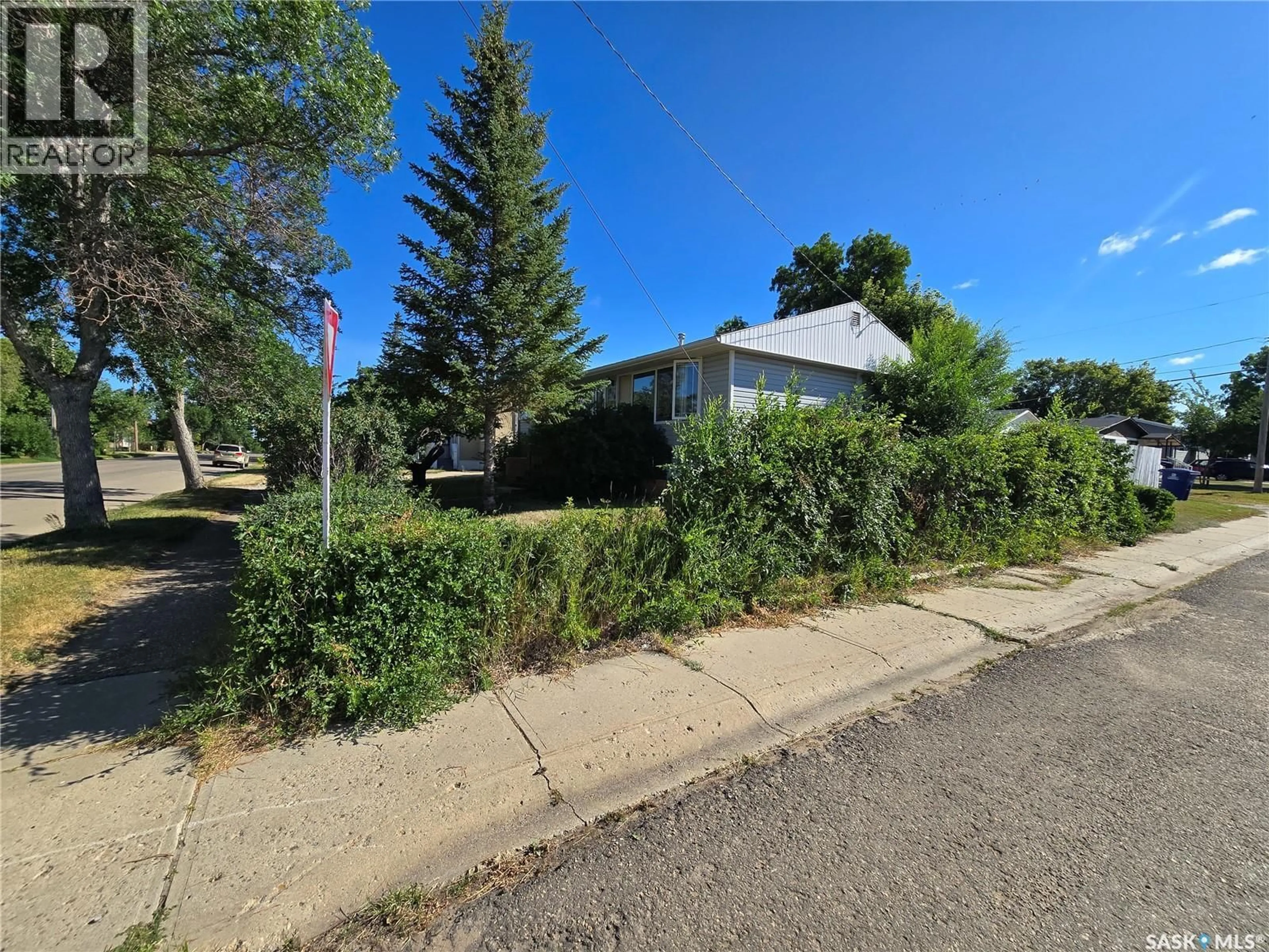 A pic from outside/outdoor area/front of a property/back of a property/a pic from drone, street for 618 3RD STREET, Weyburn Saskatchewan S4H2E1