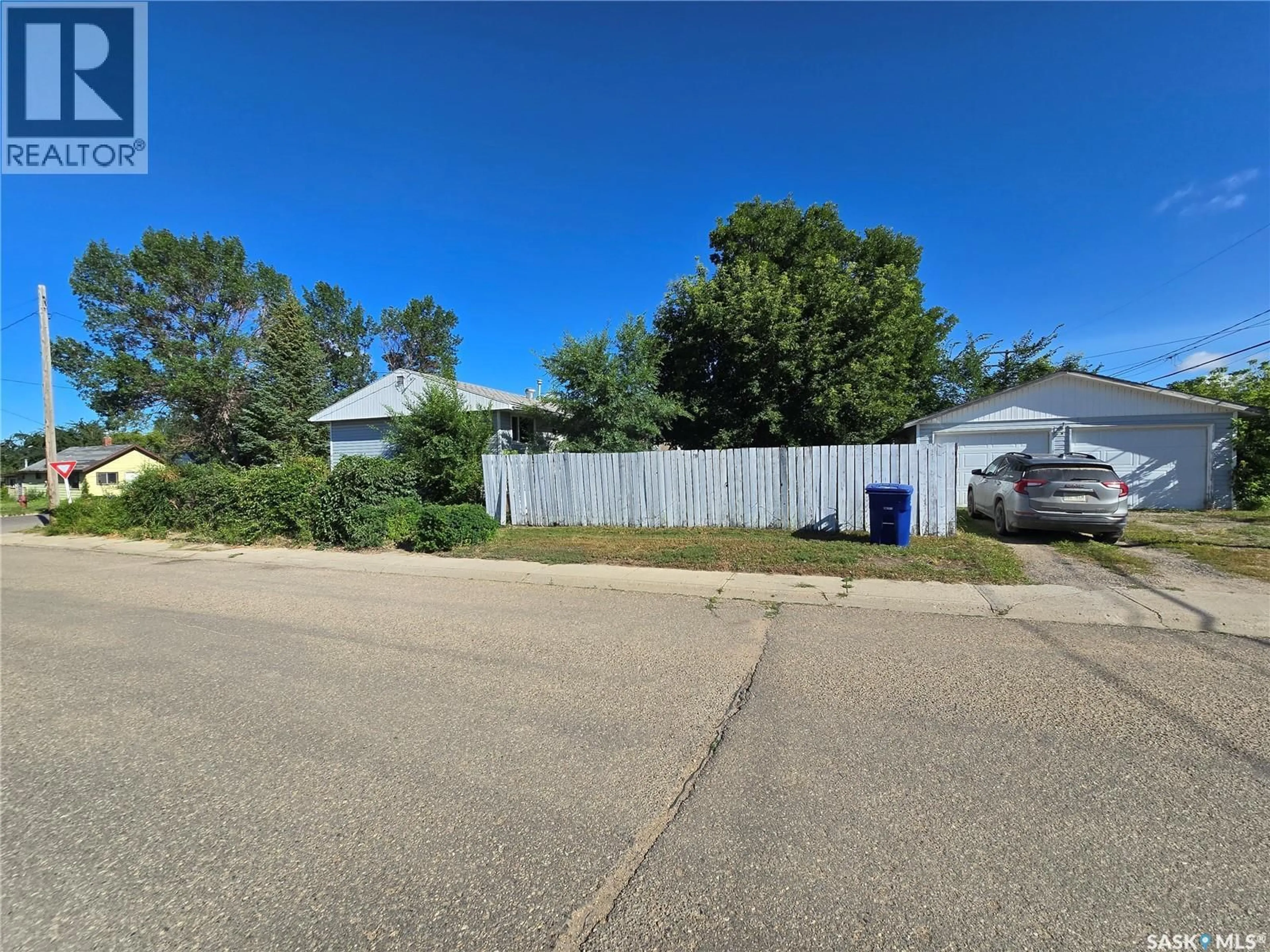 A pic from outside/outdoor area/front of a property/back of a property/a pic from drone, street for 618 3RD STREET, Weyburn Saskatchewan S4H2E1