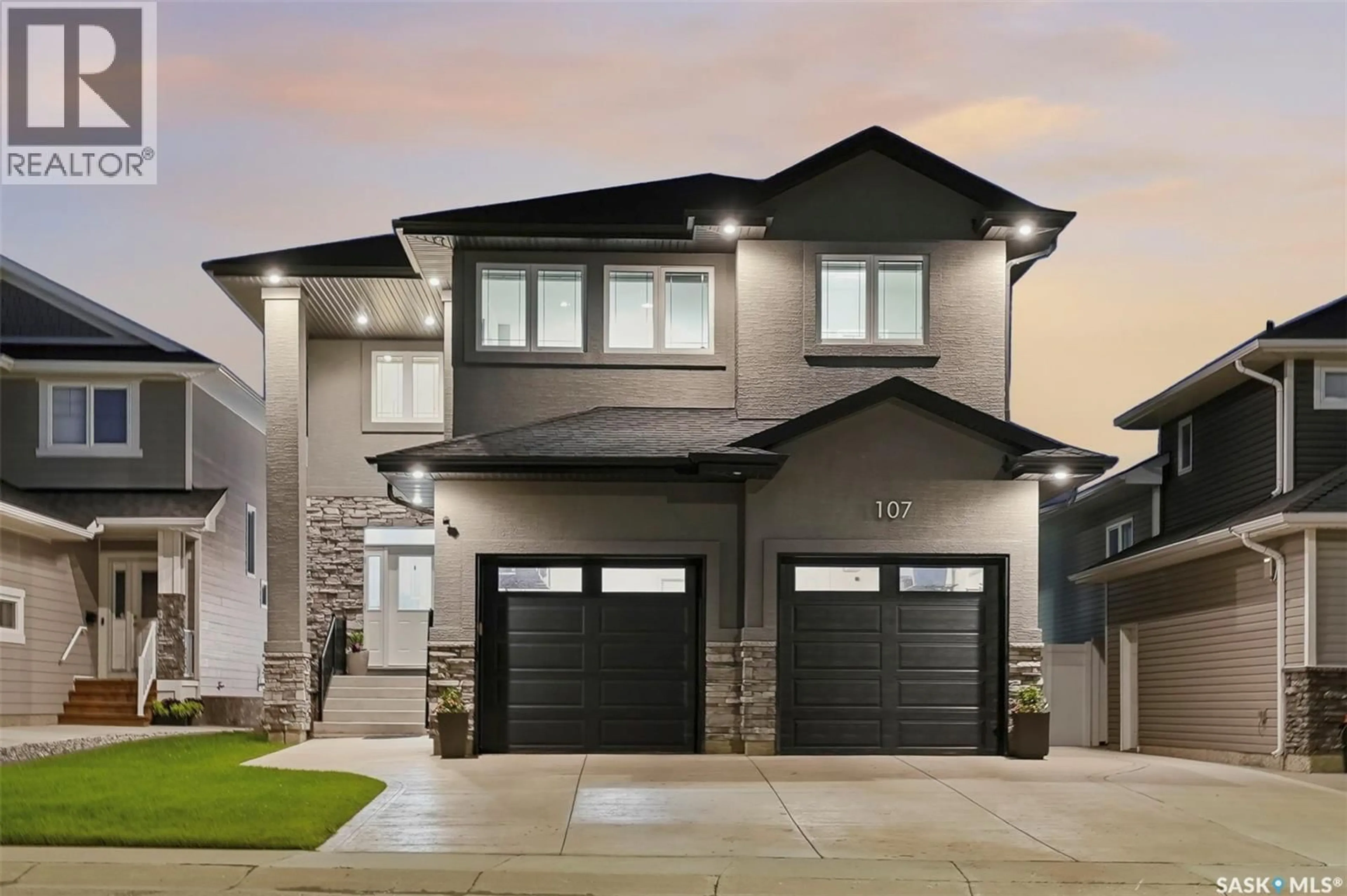 Home with vinyl exterior material, street for 107 SCHUMACHER BAY, Saskatoon Saskatchewan S7V0H7