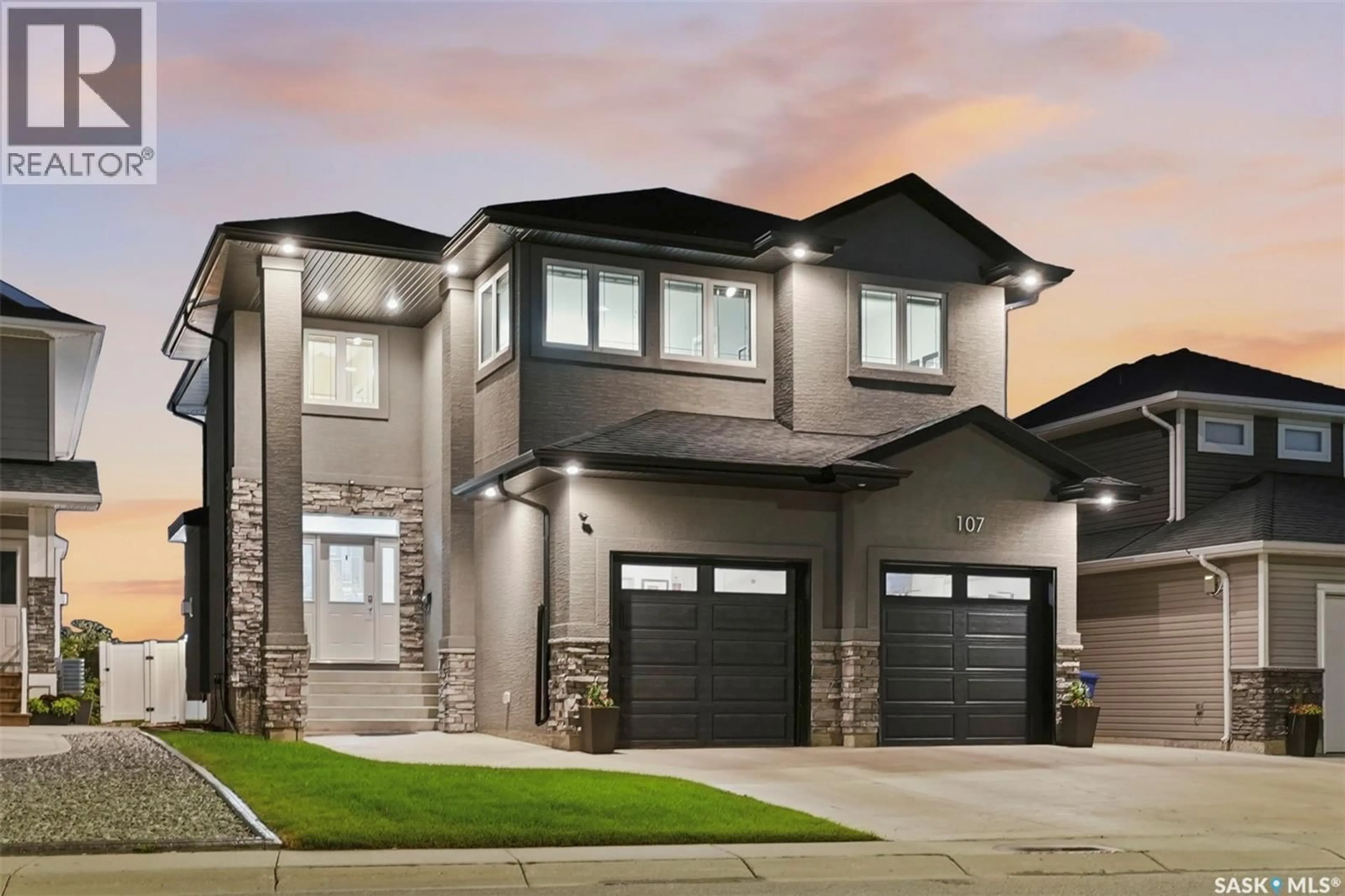 Home with vinyl exterior material, street for 107 SCHUMACHER BAY, Saskatoon Saskatchewan S7V0H7
