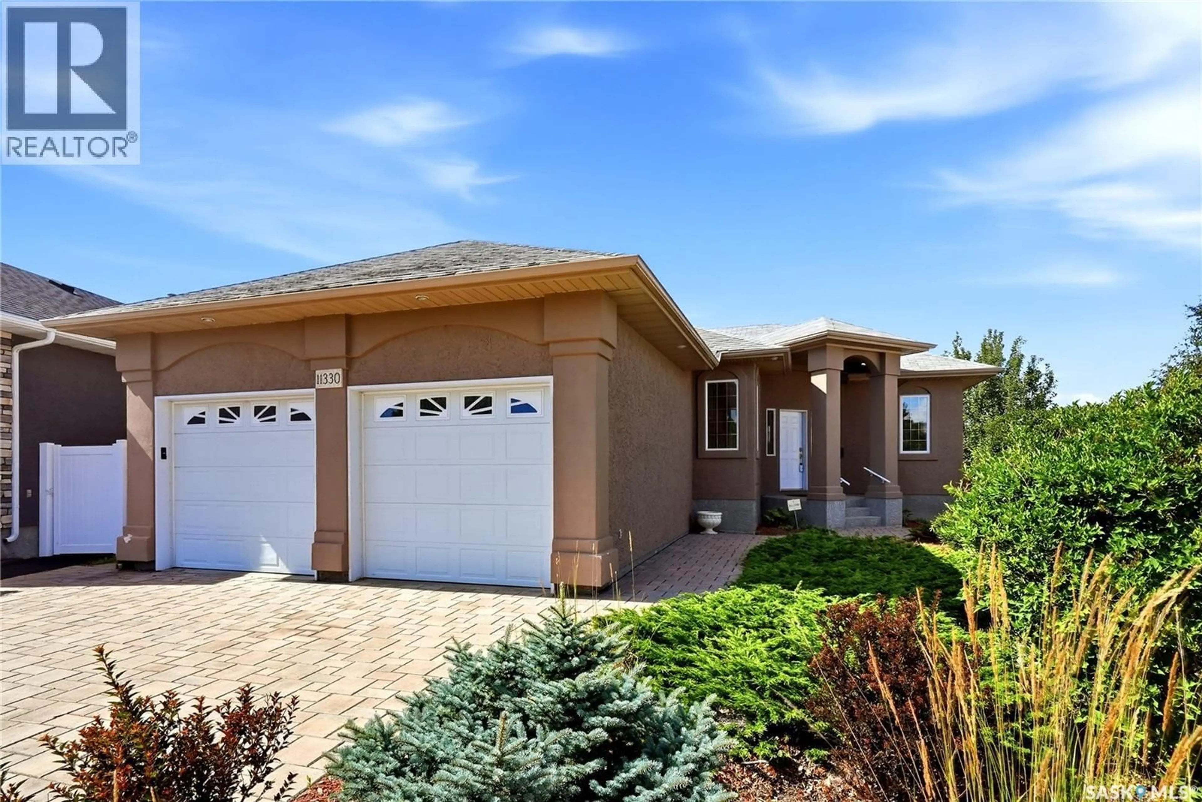 Home with brick exterior material, street for 11330 WASCANA MEADOWS, Regina Saskatchewan S4V2V4