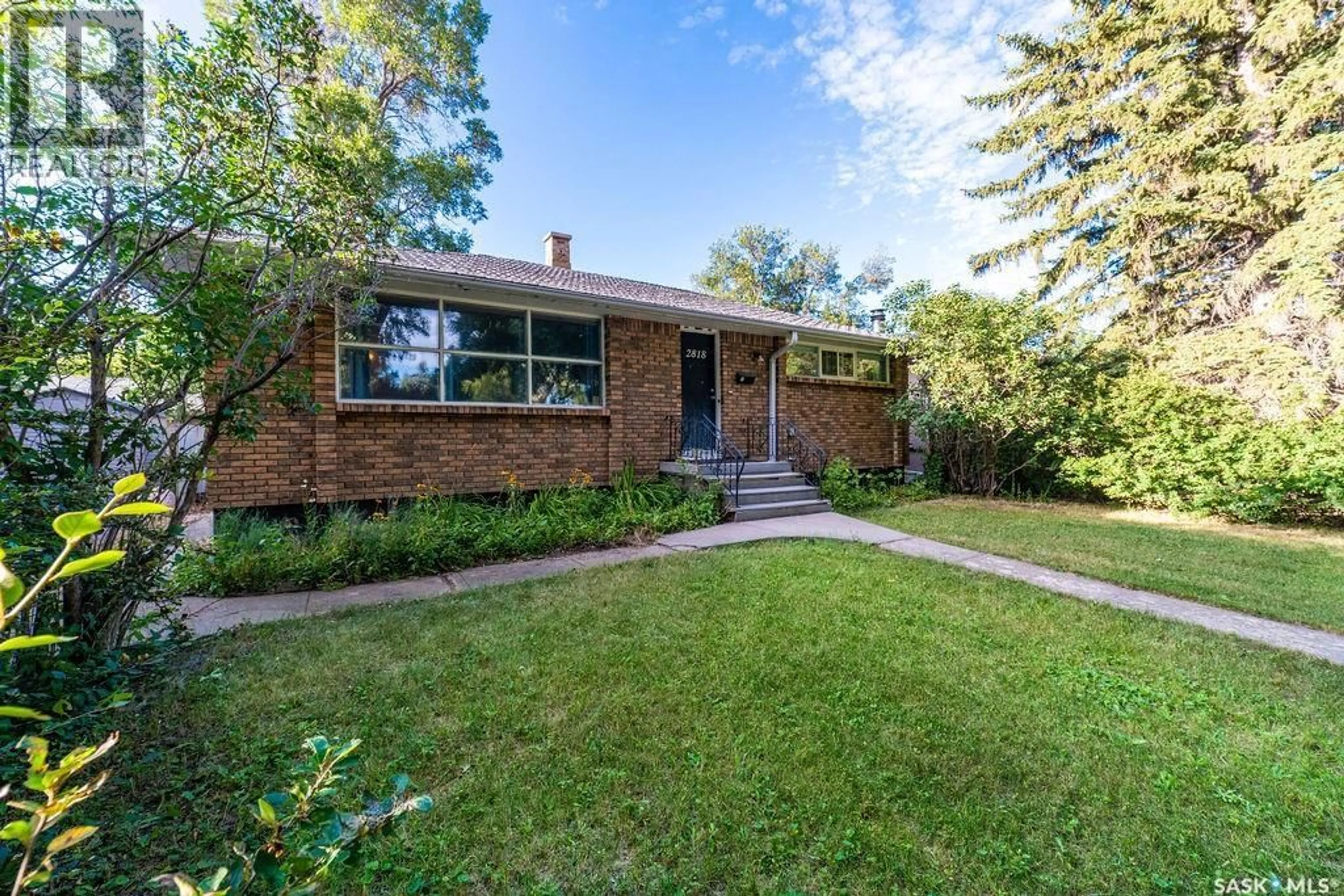 Home with brick exterior material, street for 2818 23RD AVENUE, Regina Saskatchewan S4S1E6