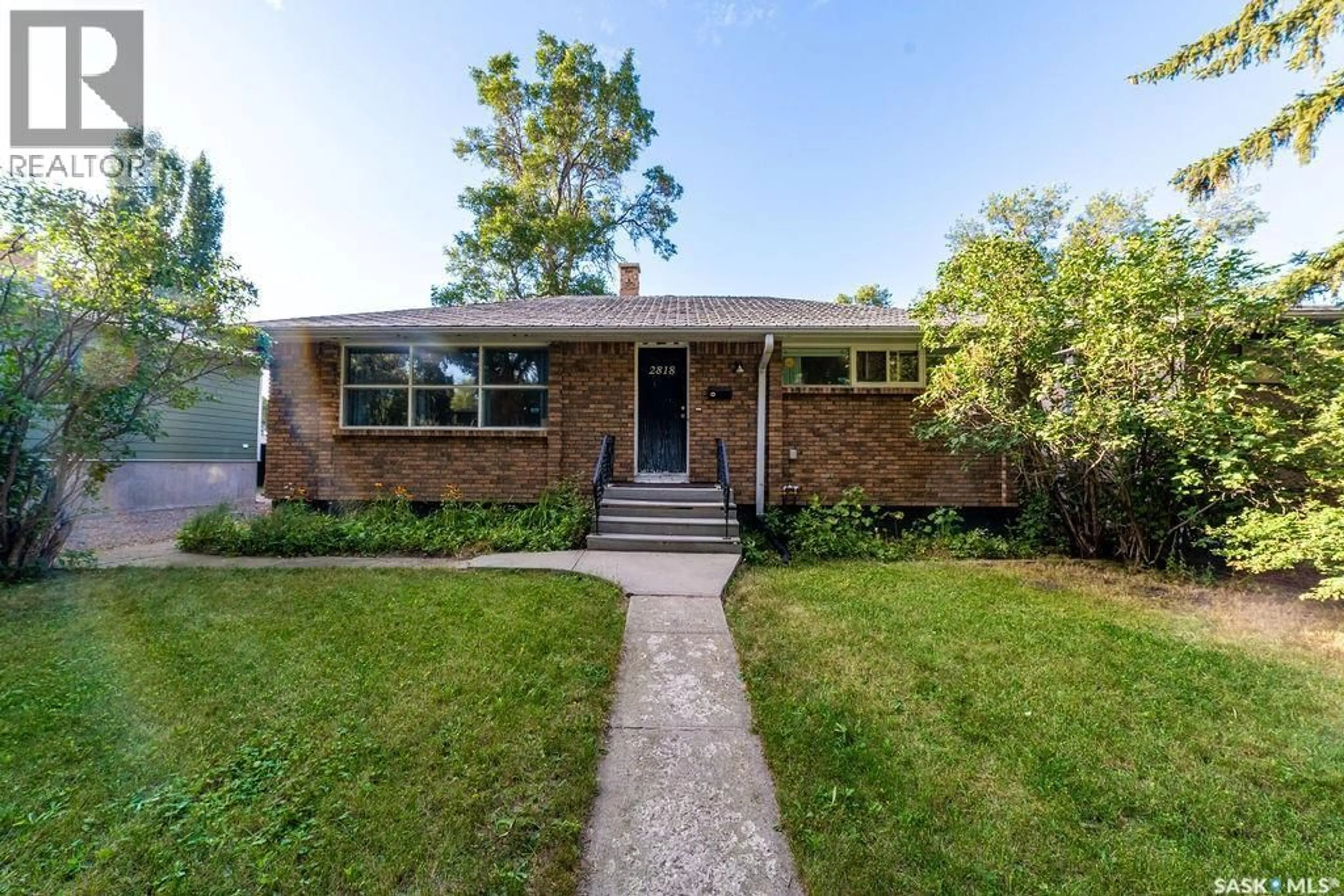 Home with brick exterior material, street for 2818 23RD AVENUE, Regina Saskatchewan S4S1E6