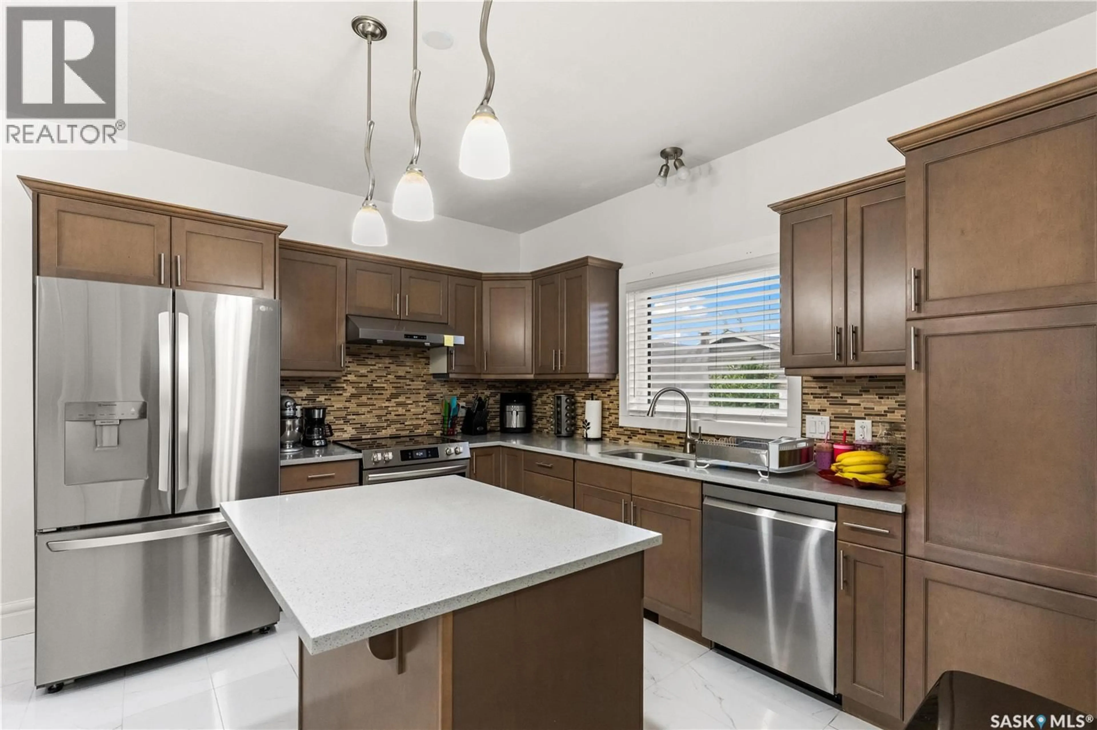Open concept kitchen, ceramic/tile floor for 230 WYANT LANE, Saskatoon Saskatchewan S7S1N1
