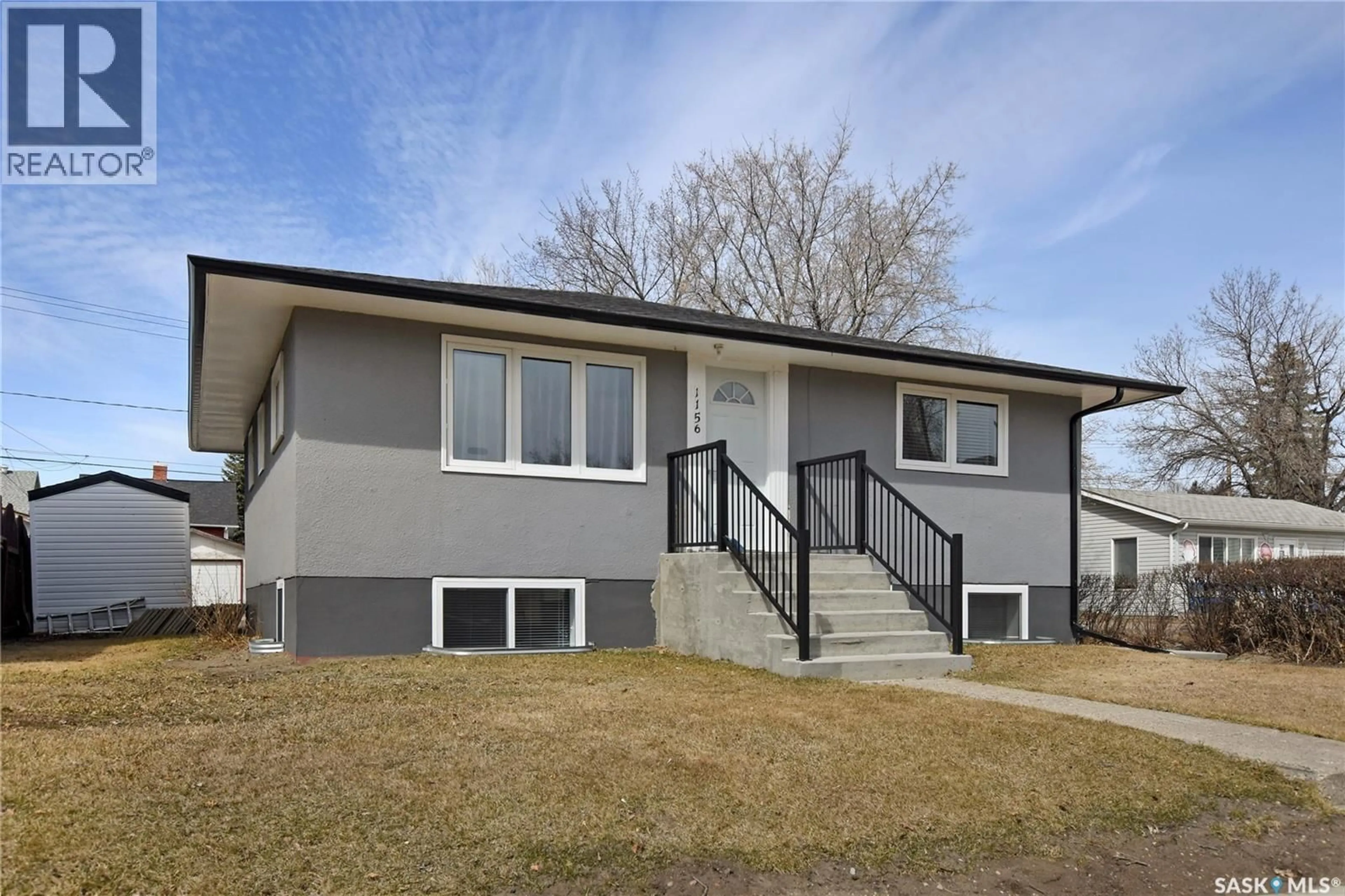 Home with vinyl exterior material, street for 1156 4TH AVENUE, Moose Jaw Saskatchewan S6H3X4