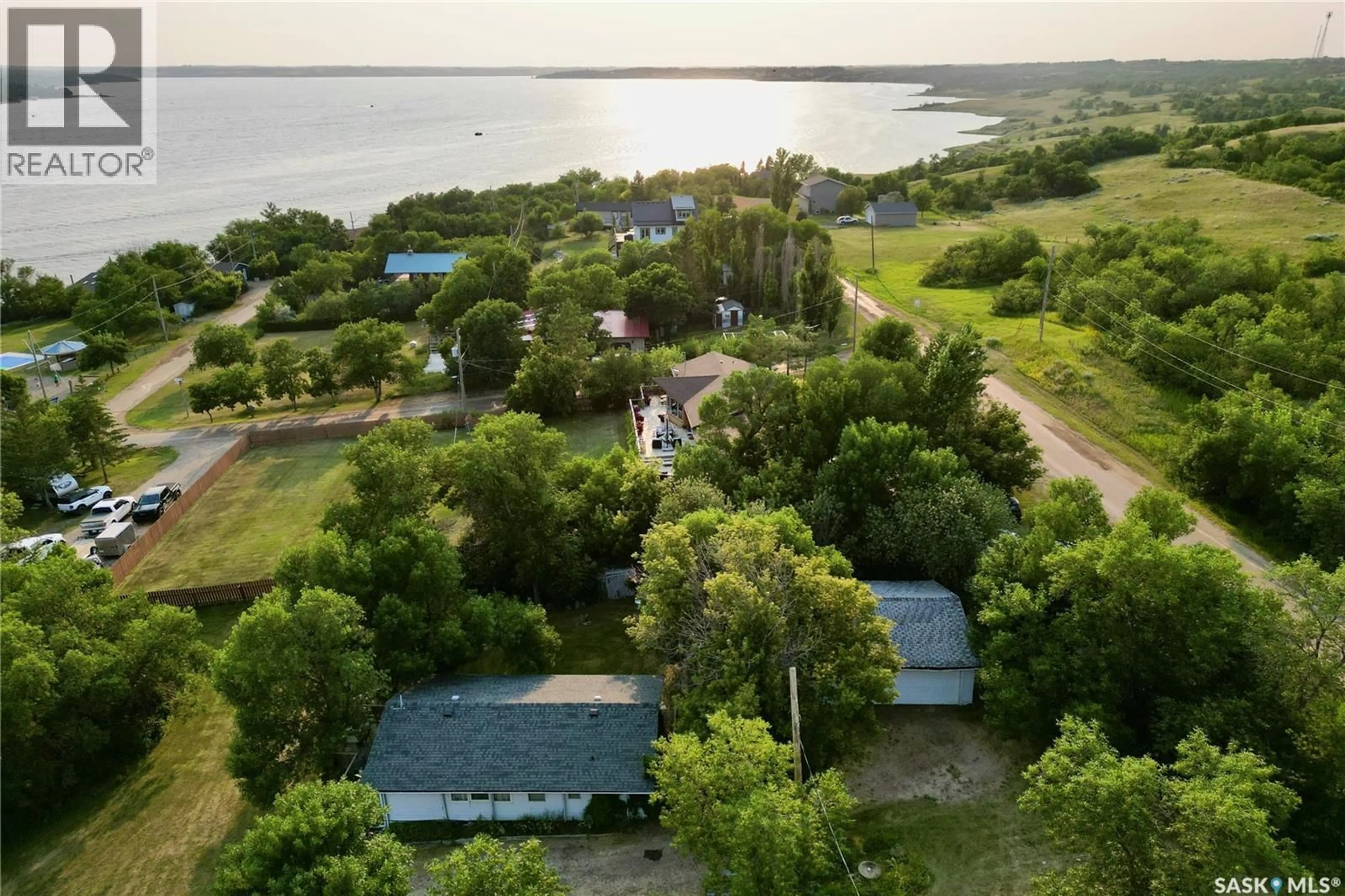 A pic from outside/outdoor area/front of a property/back of a property/a pic from drone, water/lake/river/ocean view for 300-306 PERCH CRESCENT, Last Mountain Lake Saskatchewan S0G4L0