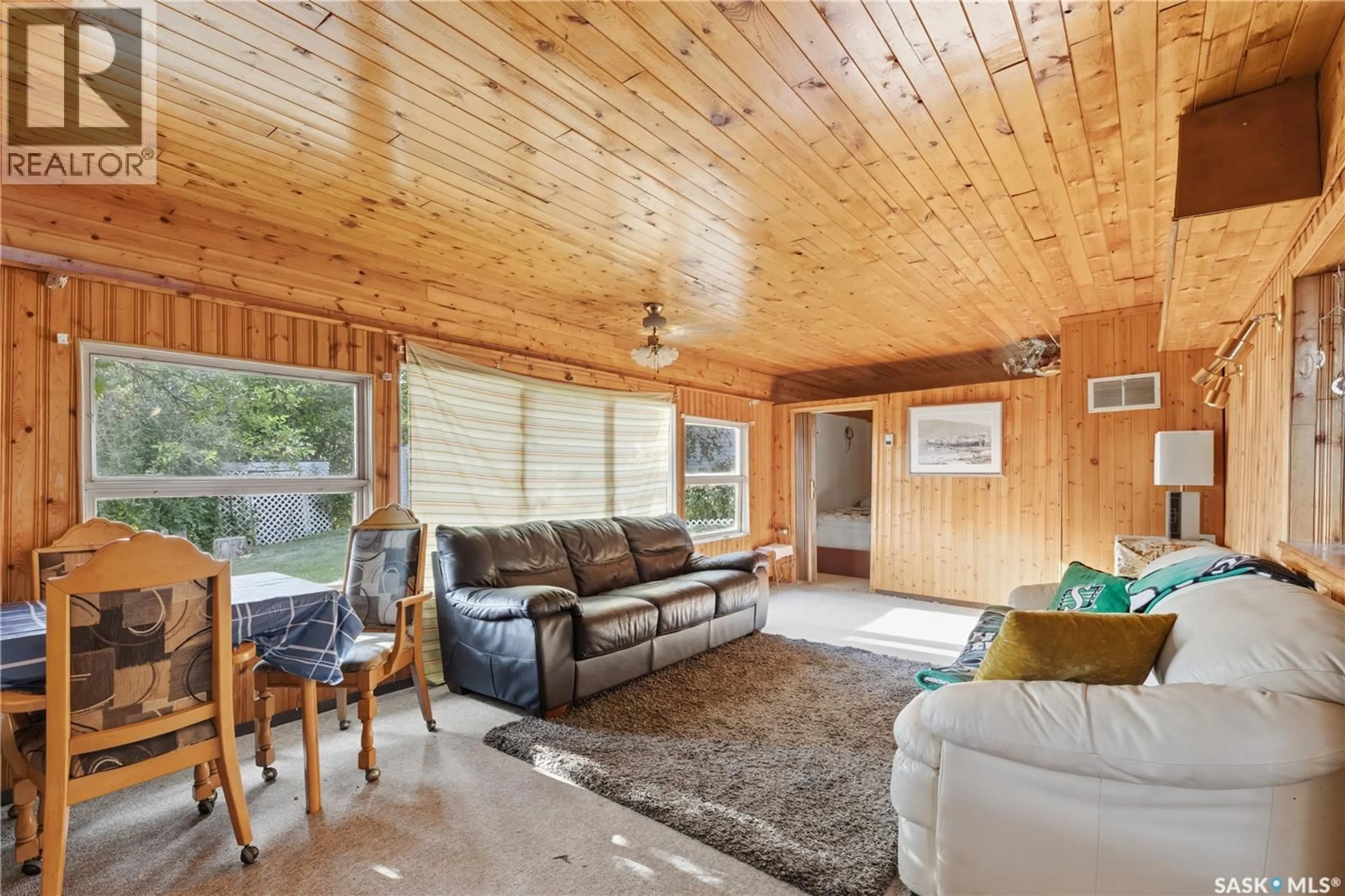 Living room with furniture, wood/laminate floor for 300-306 PERCH CRESCENT, Last Mountain Lake Saskatchewan S0G4L0